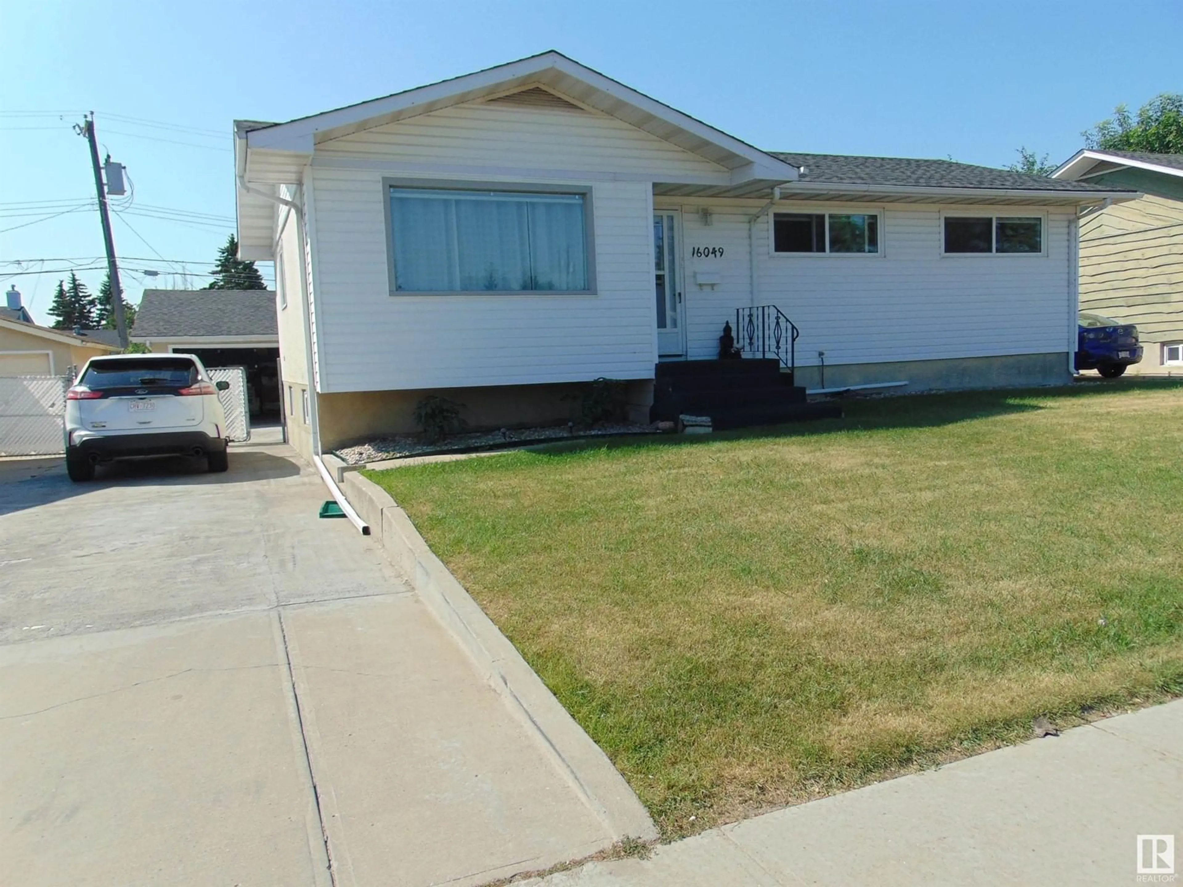 Frontside or backside of a home for 16049 95 AV NW, Edmonton Alberta T5P0A8