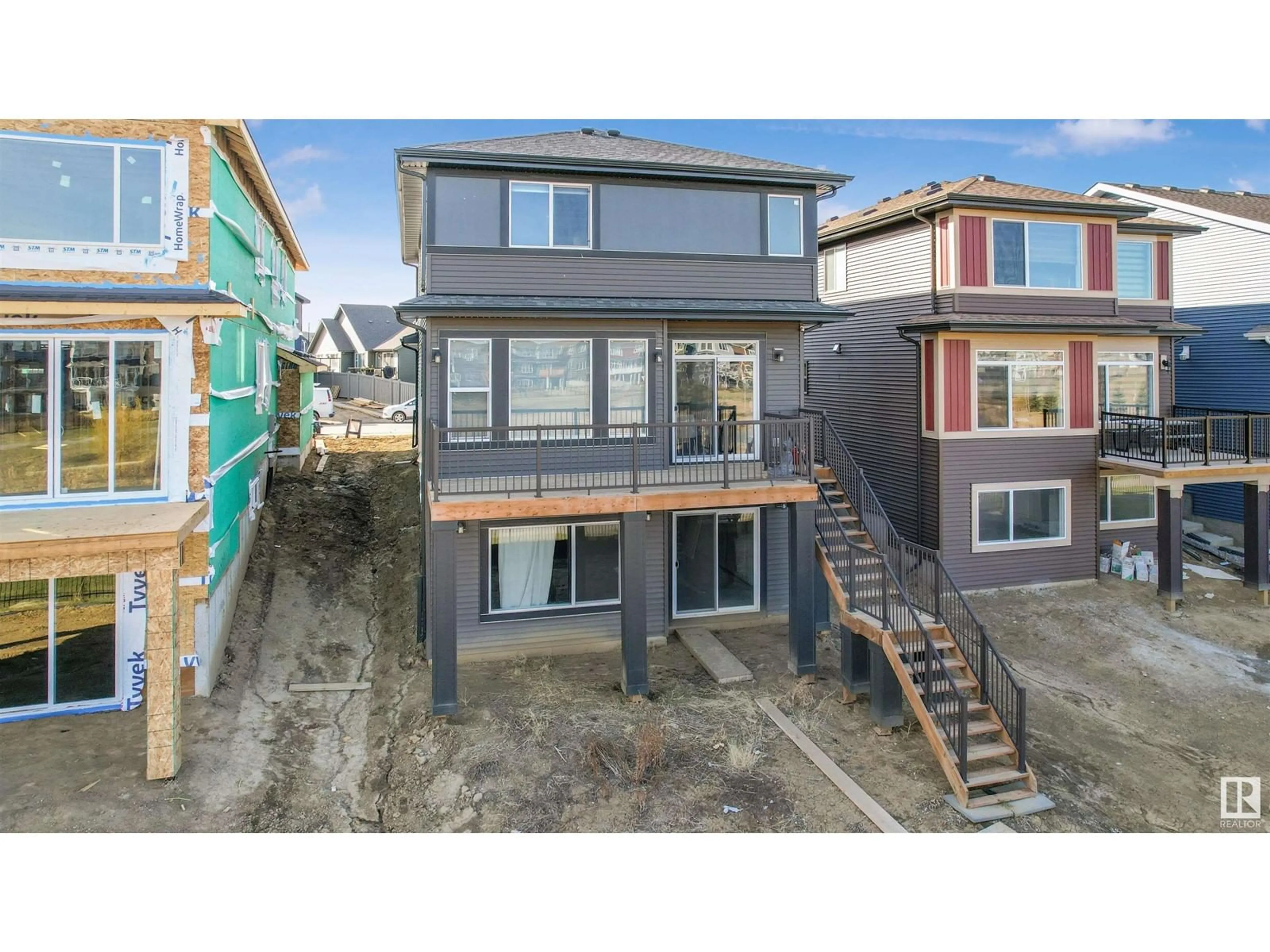 A pic from exterior of the house or condo, the fenced backyard for 8123 220 ST NW, Edmonton Alberta T5T7T4