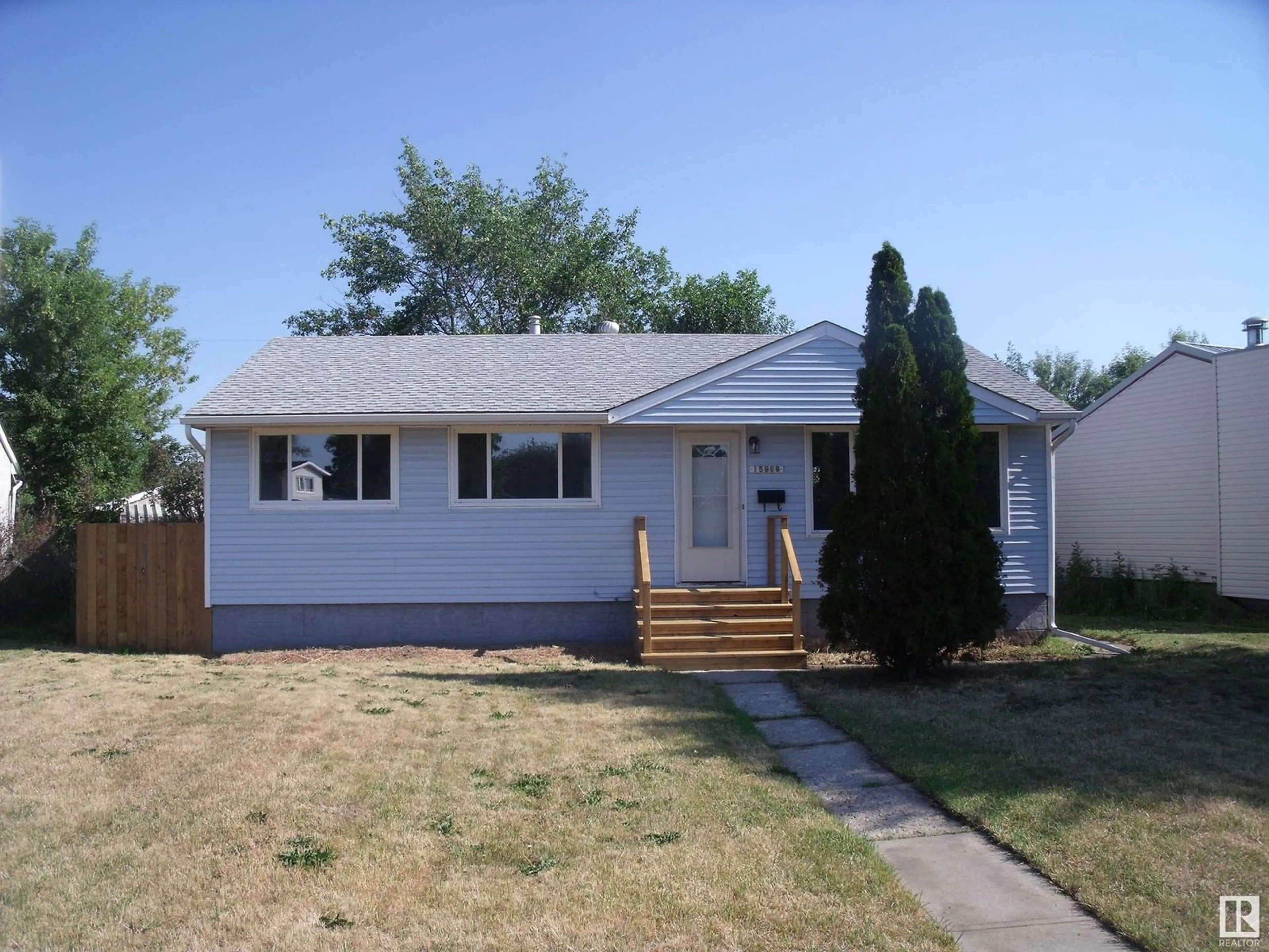 Frontside or backside of a home for 15966 106 AV NW, Edmonton Alberta T5P0W7