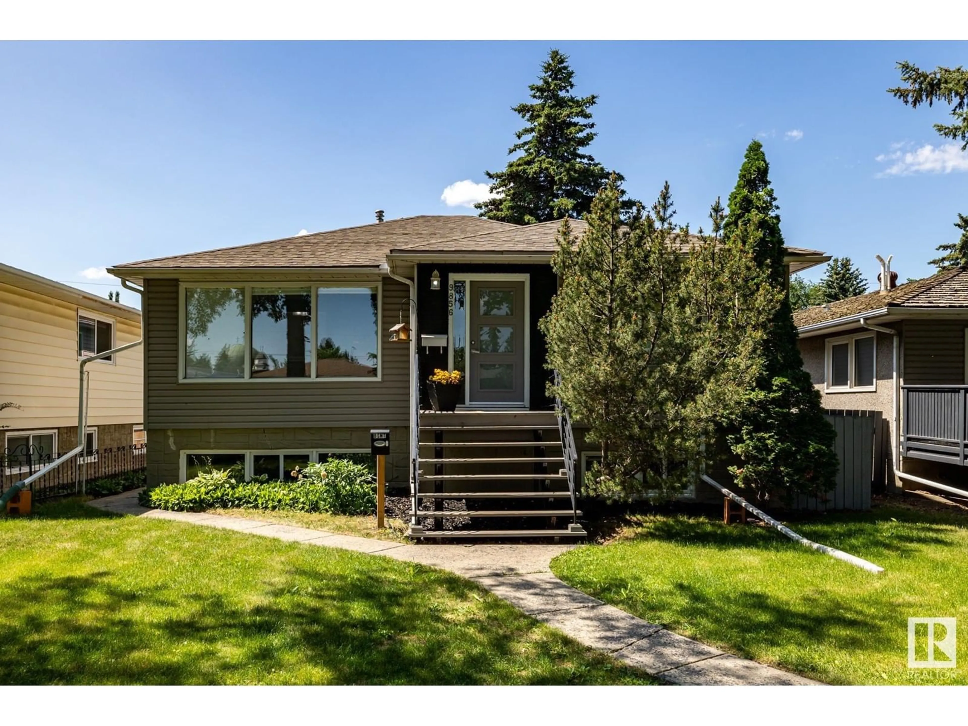 Frontside or backside of a home for 9856 76 ST NW, Edmonton Alberta T6A3A2