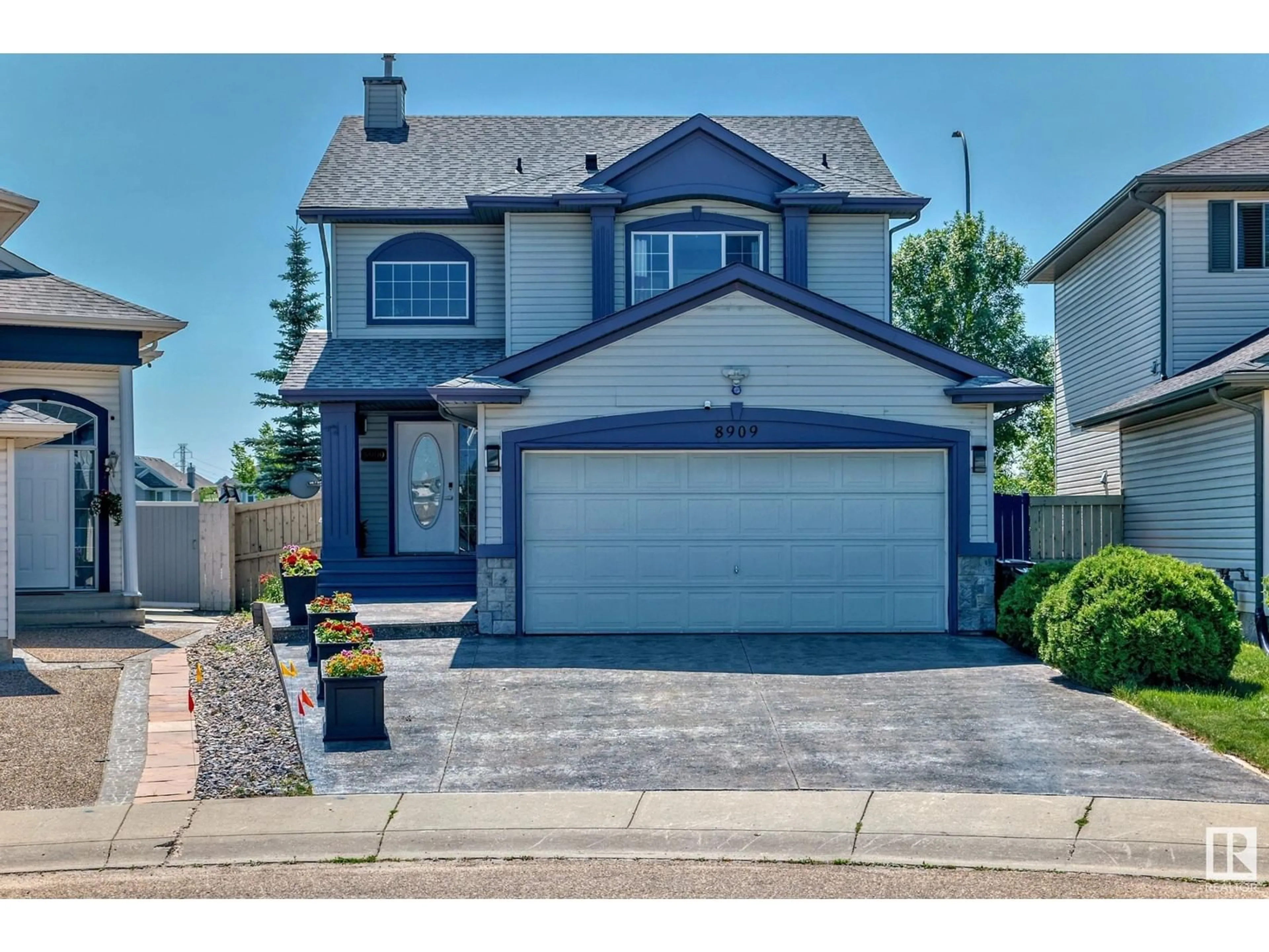 Frontside or backside of a home for 8909 8 AV SW, Edmonton Alberta T6X1B9