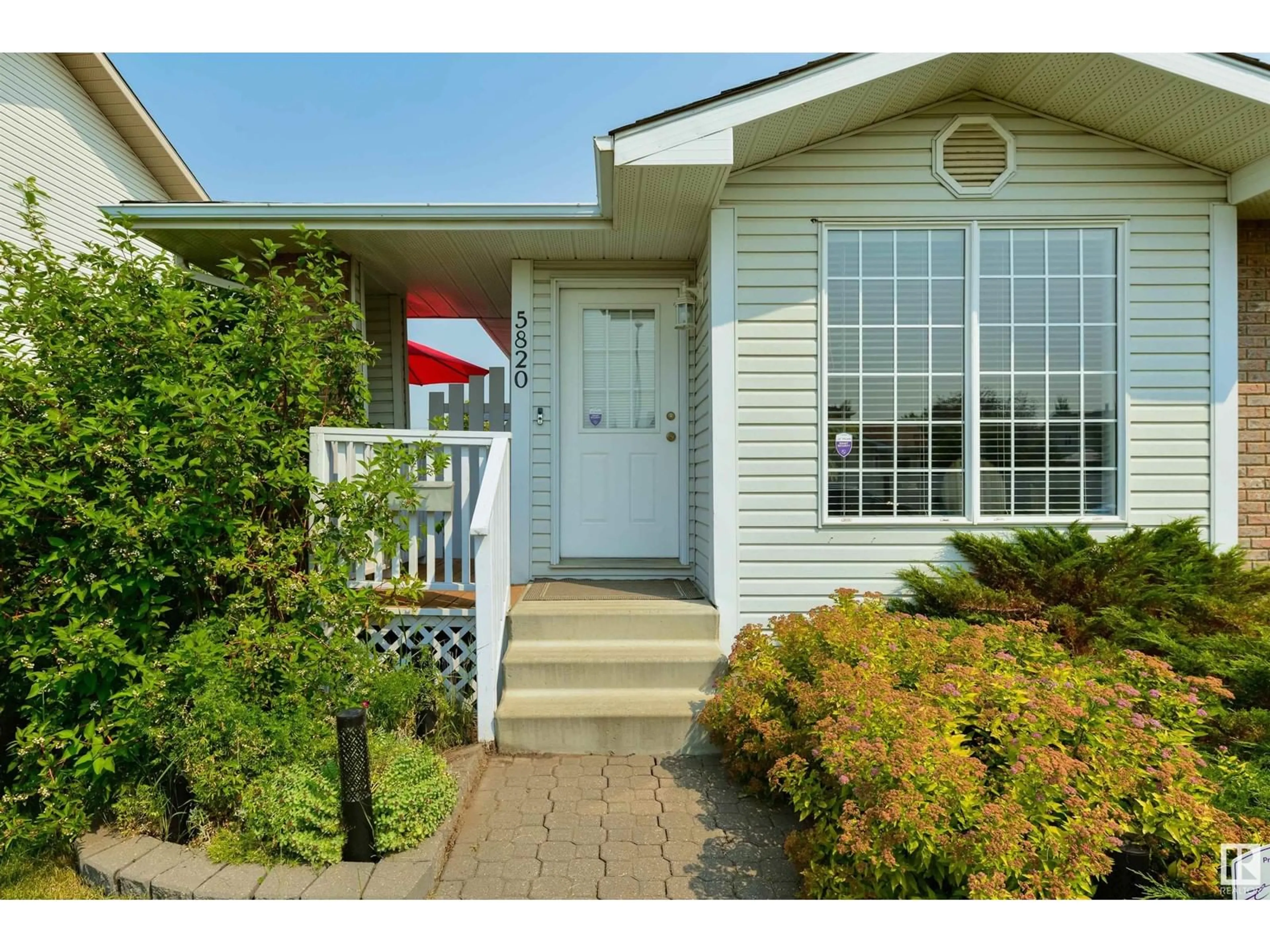 Home with vinyl exterior material for 5820 162 AV NW, Edmonton Alberta T5Y2S8