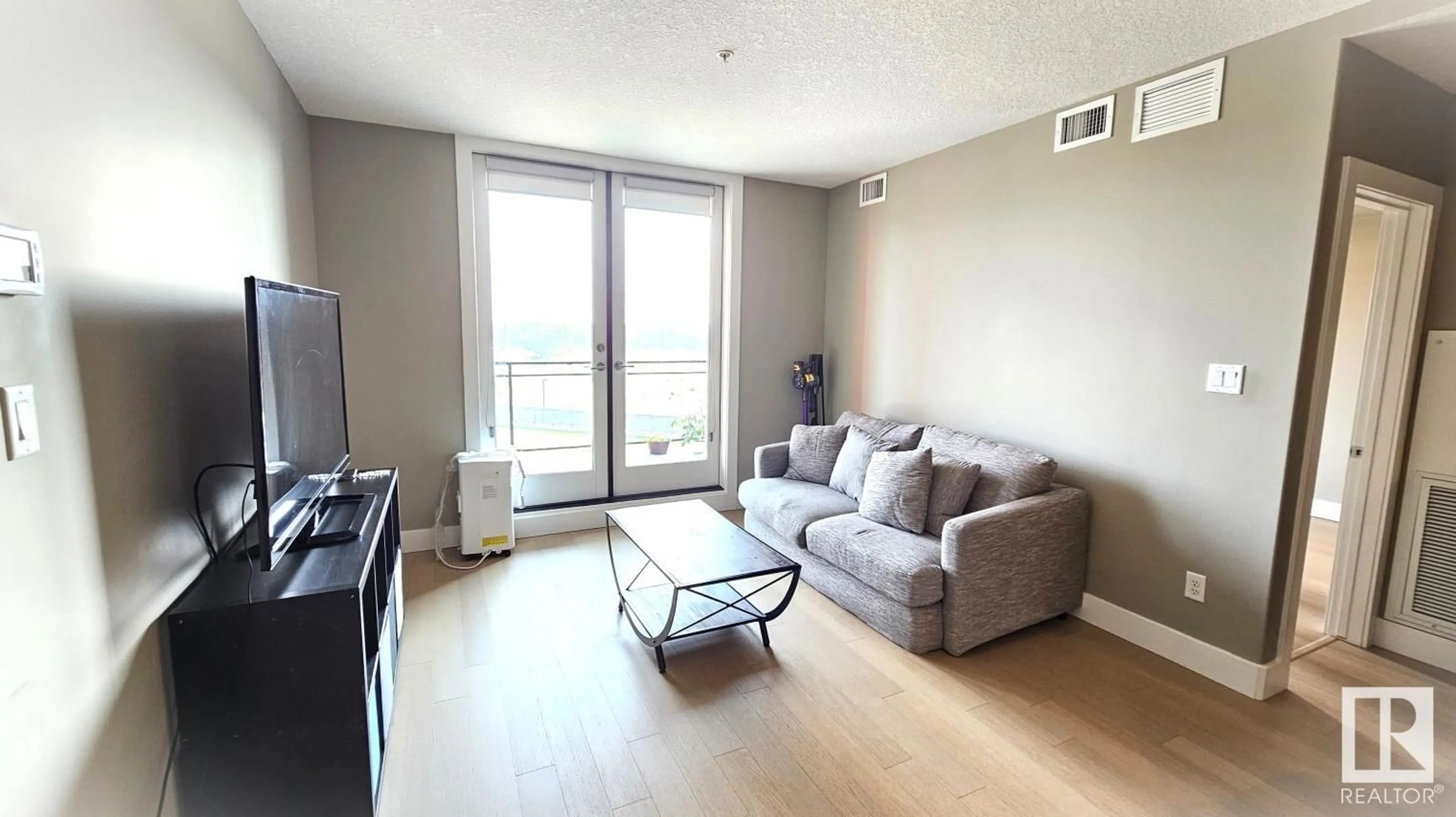 Living room, wood floors for #416 11080 Ellerslie RD SW SW, Edmonton Alberta T6W2C2