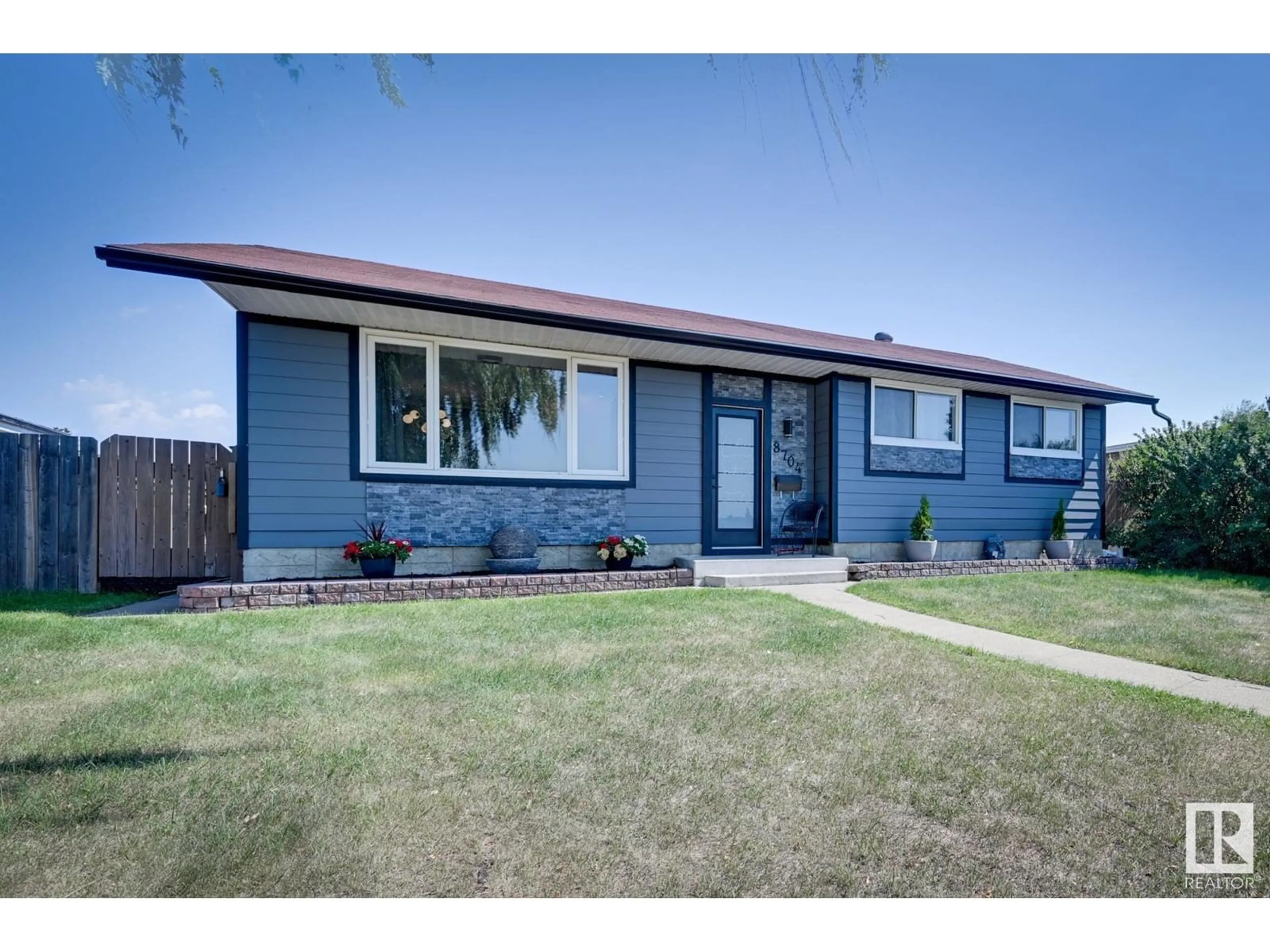 Frontside or backside of a home for 8704 150 AV NW, Edmonton Alberta T5E1G2