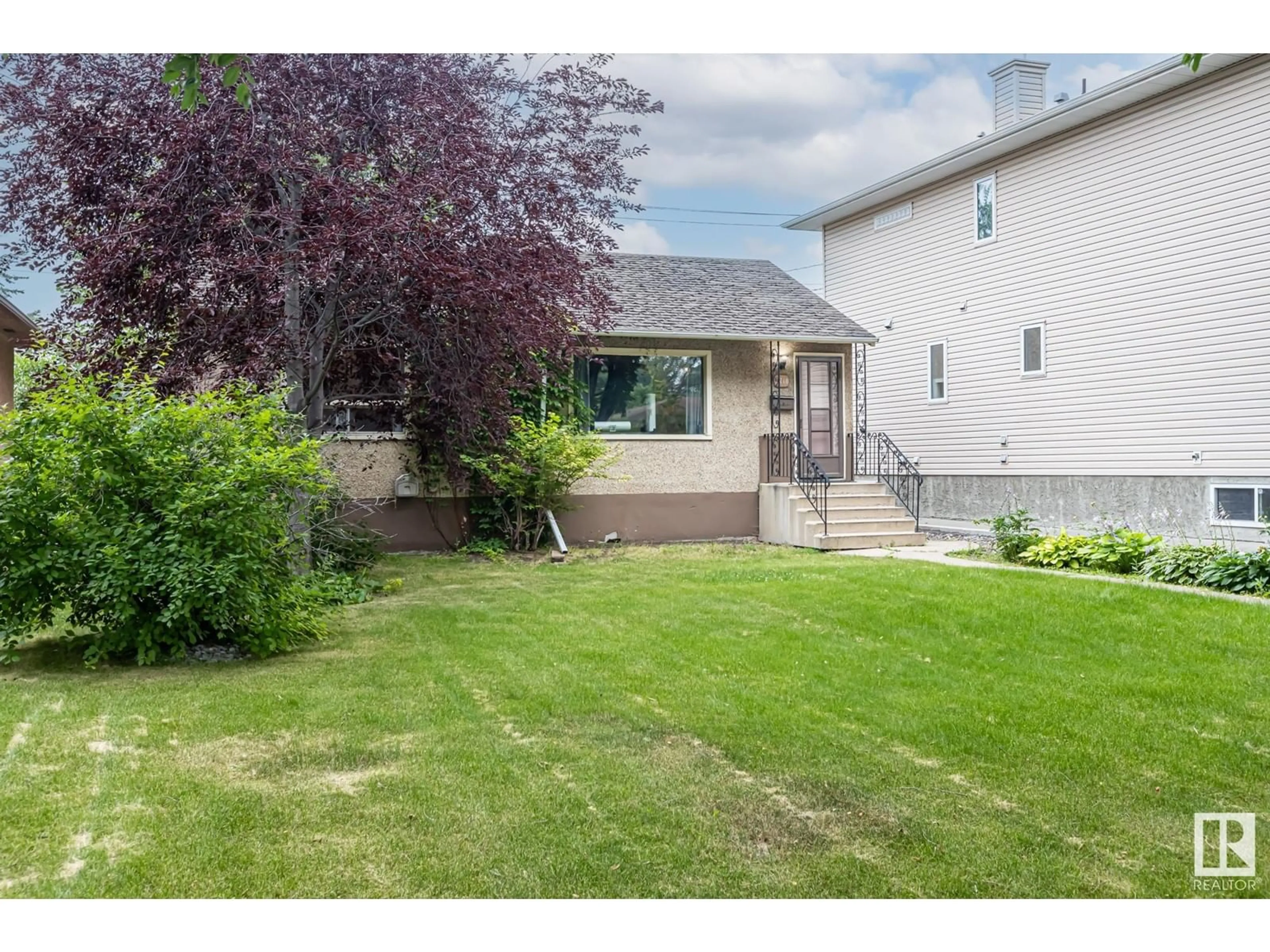 Frontside or backside of a home for 7710 81 AV NW, Edmonton Alberta T6C0V5