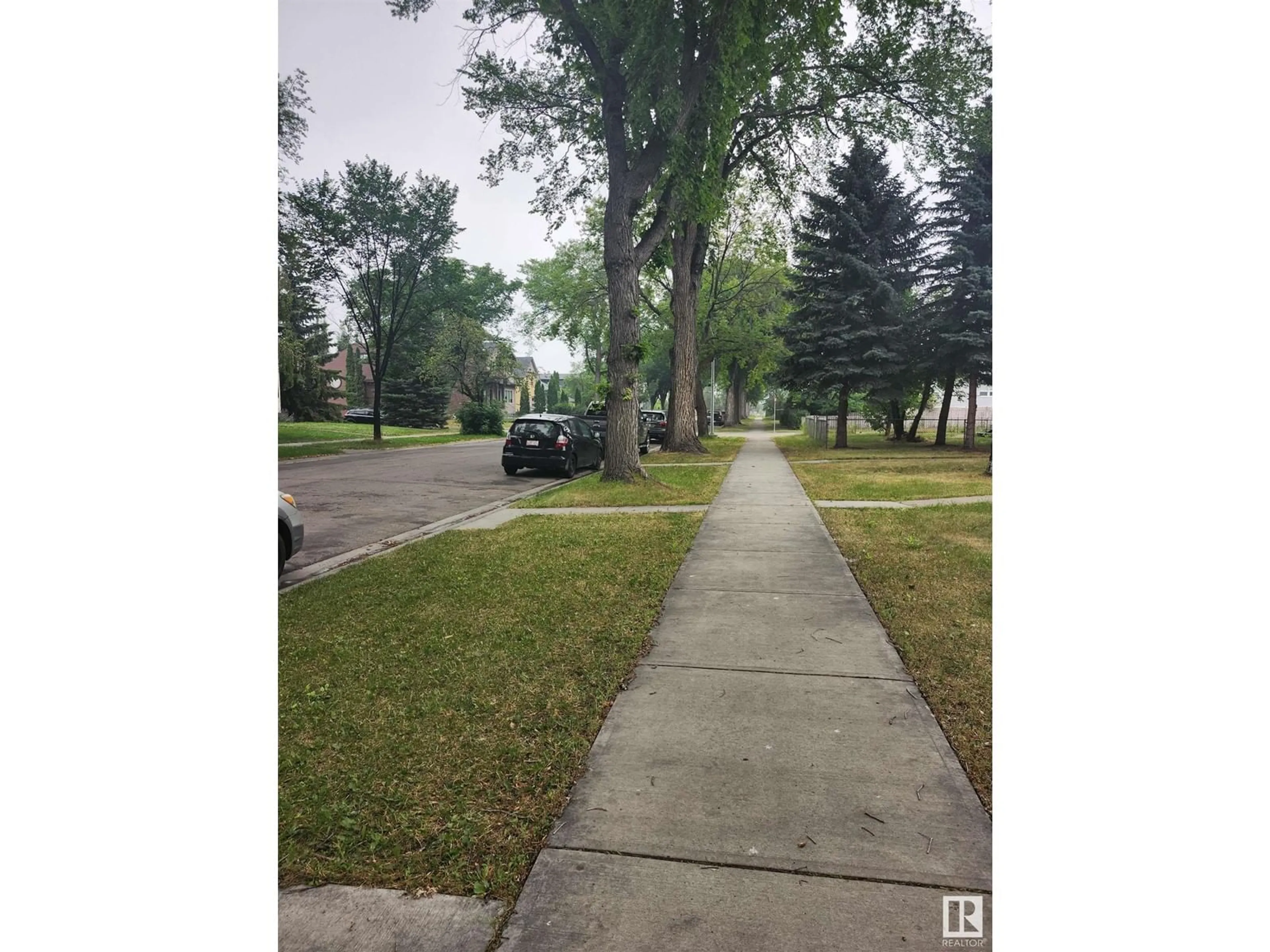 Frontside or backside of a home, the street view for 12239 101 ST NW, Edmonton Alberta T5G2C5