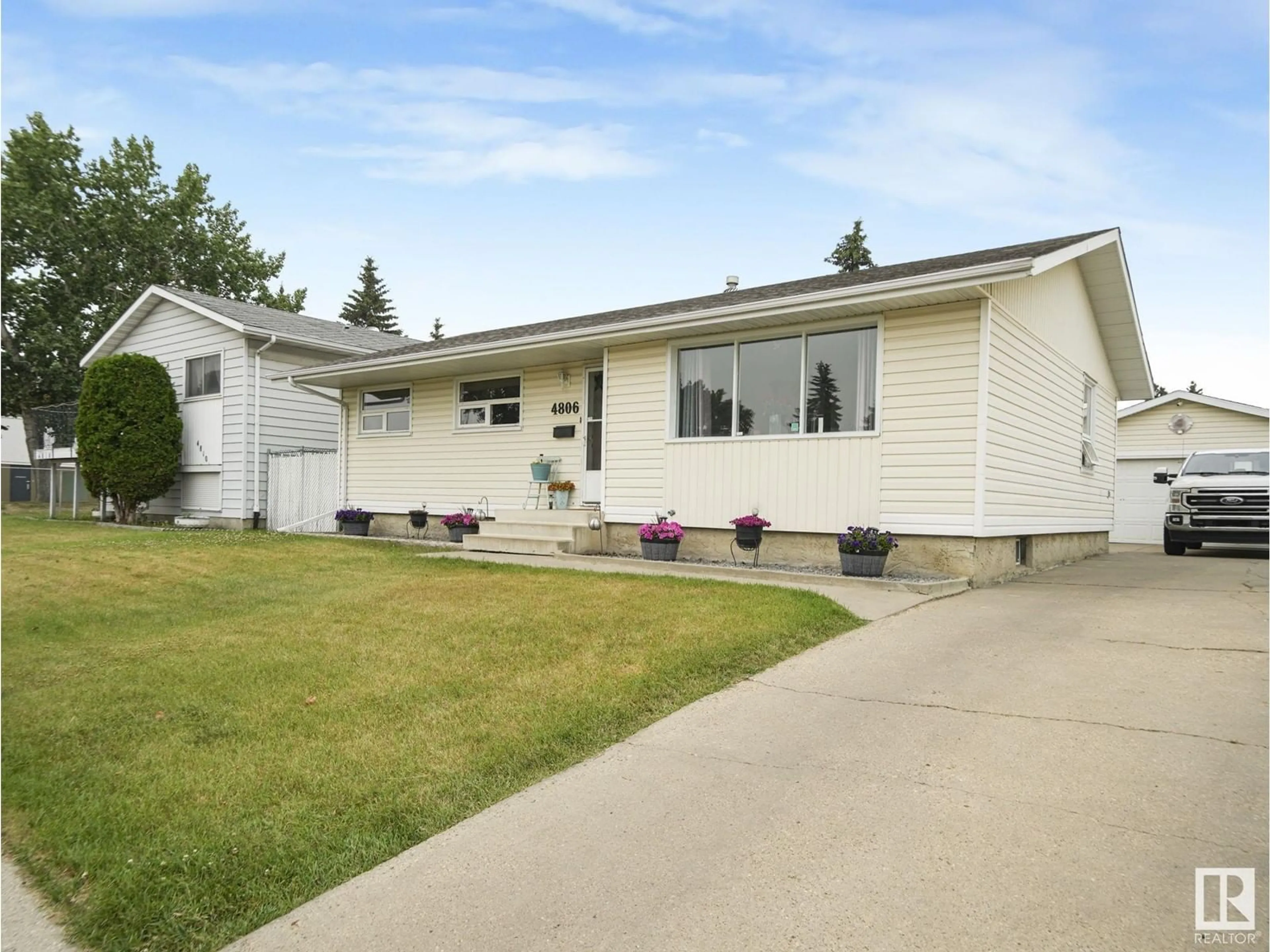 Frontside or backside of a home for 4806 127B AV NW, Edmonton Alberta T5A2M9