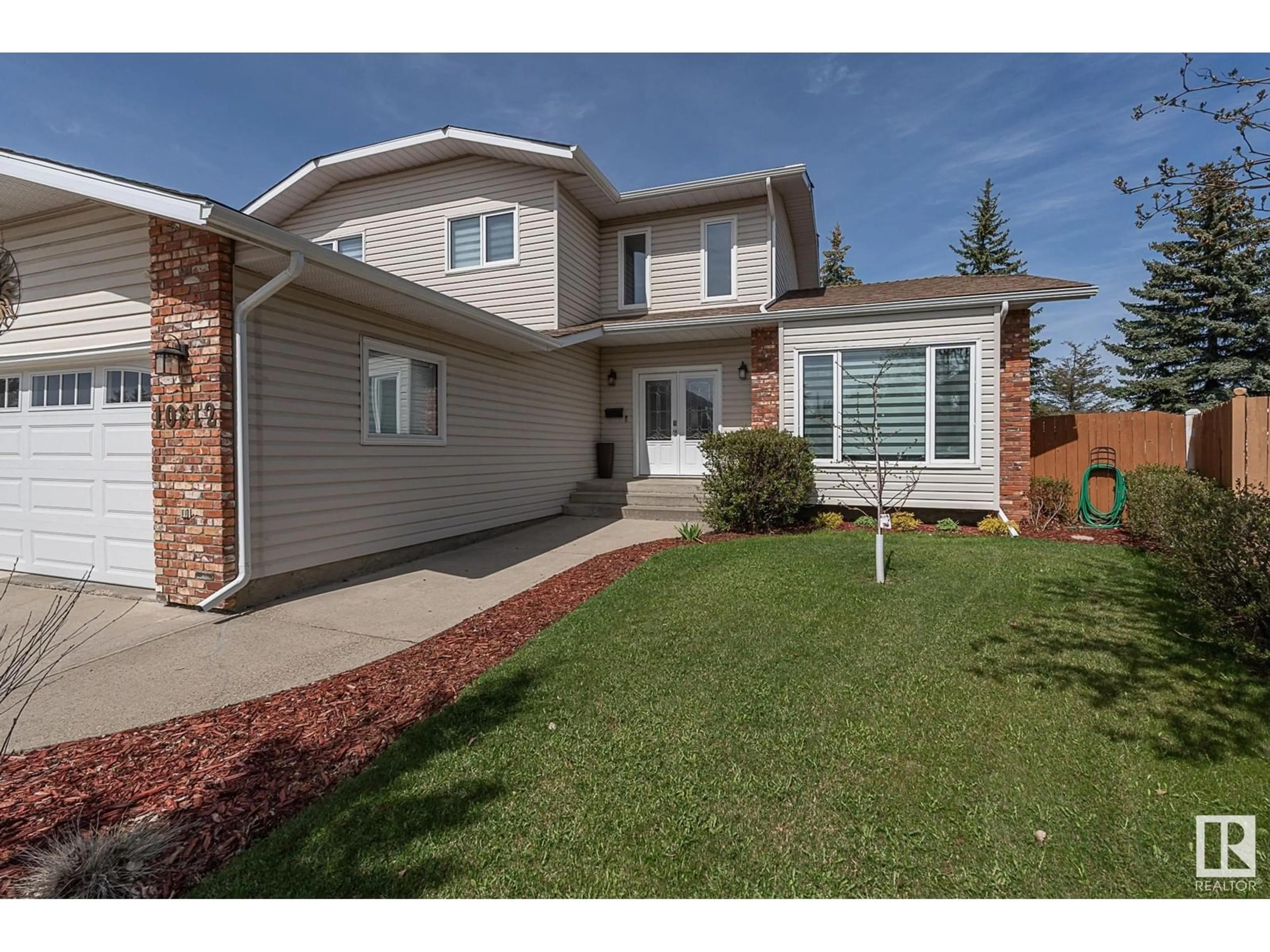 Frontside or backside of a home for 10812 18 AV NW, Edmonton Alberta T6J6P1
