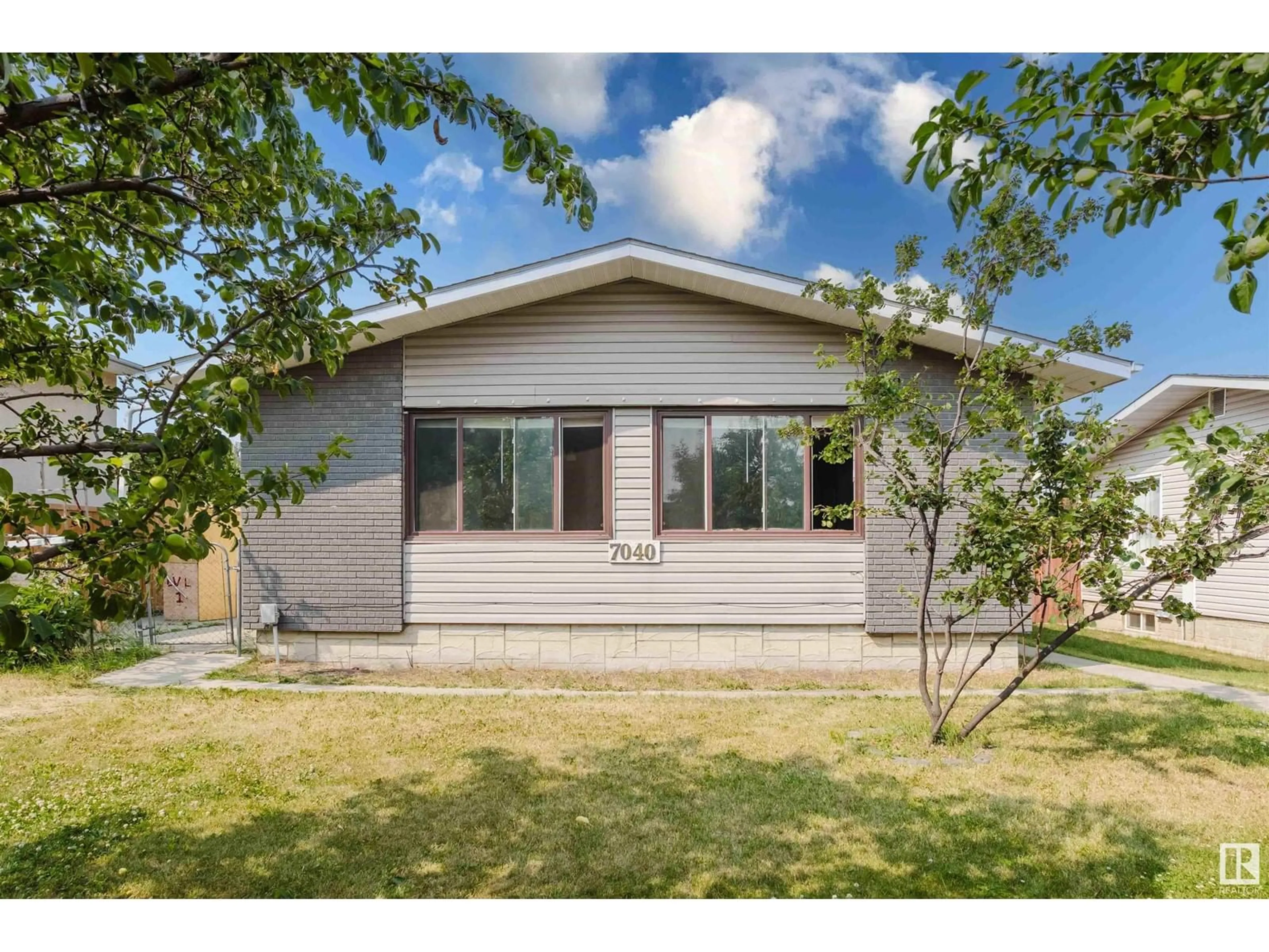 Frontside or backside of a home for 7040 138 AV NW, Edmonton Alberta T5C2L8