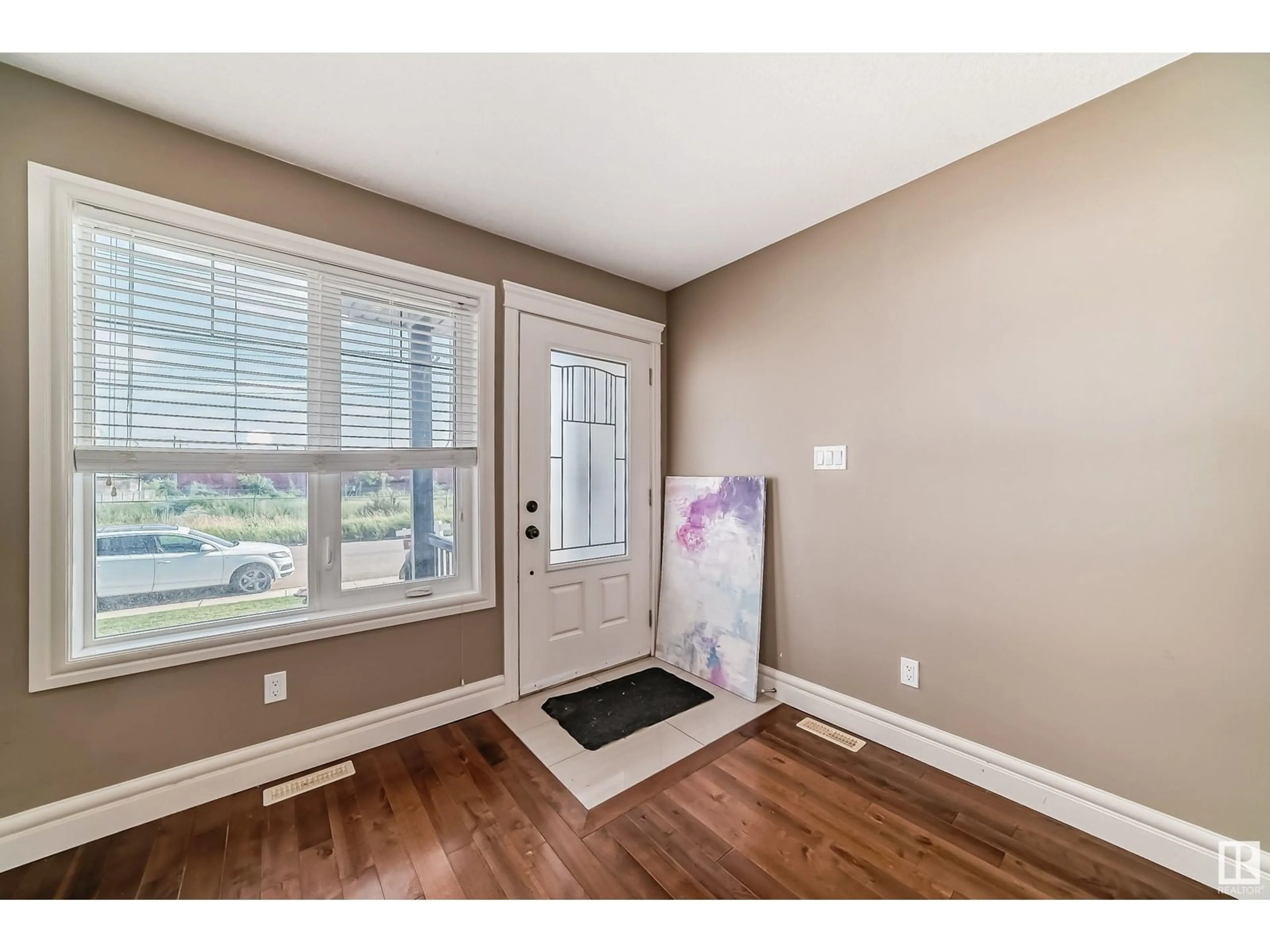 Indoor entryway, wood floors for 12722 127 AV NW NW, Edmonton Alberta T5L1E2