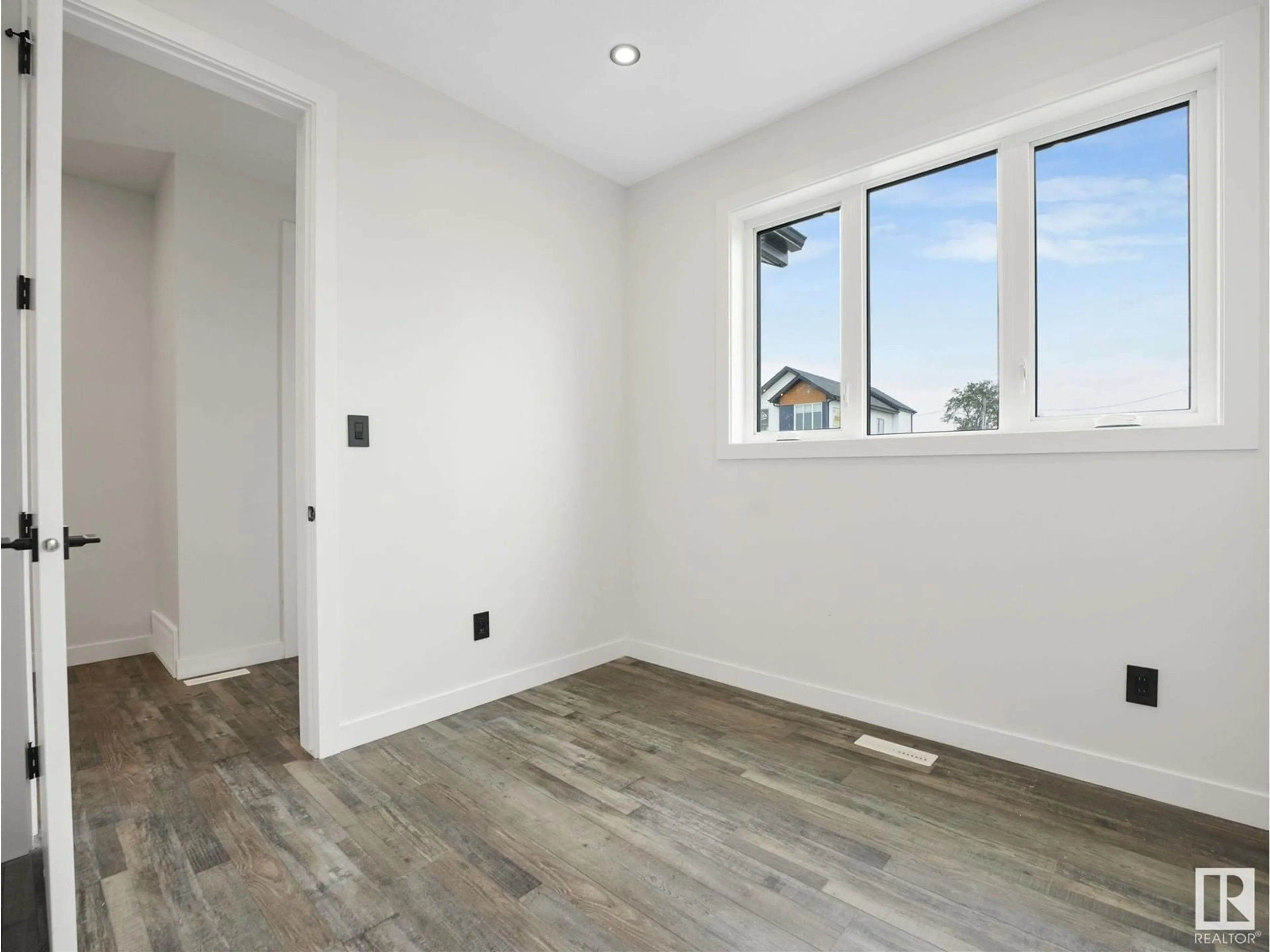 A pic of a room, wood floors for 12475 47 ST NW NW, Edmonton Alberta T5W5E5