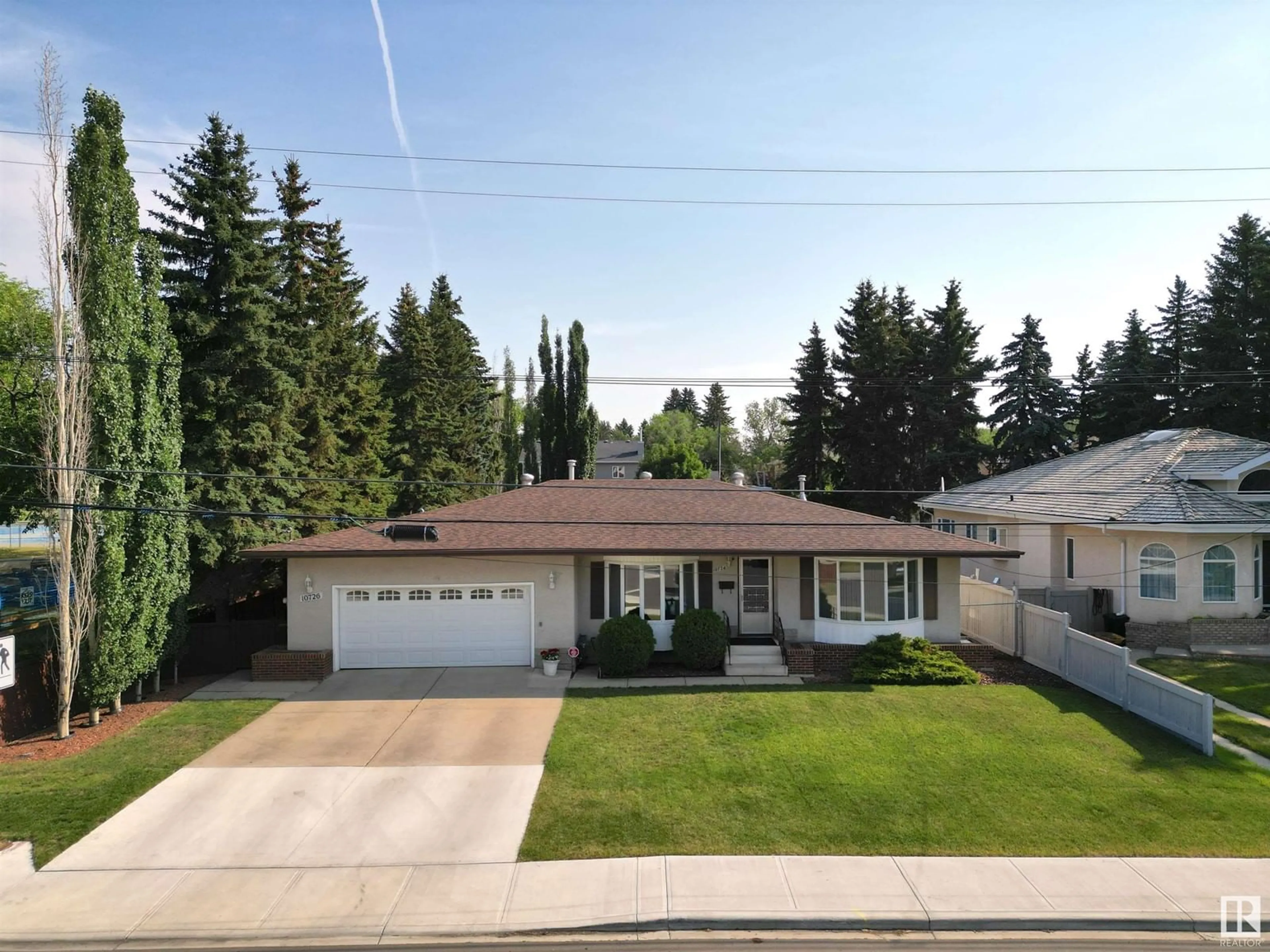 Frontside or backside of a home for 10726 57 AV NW, Edmonton Alberta T6H0Y6