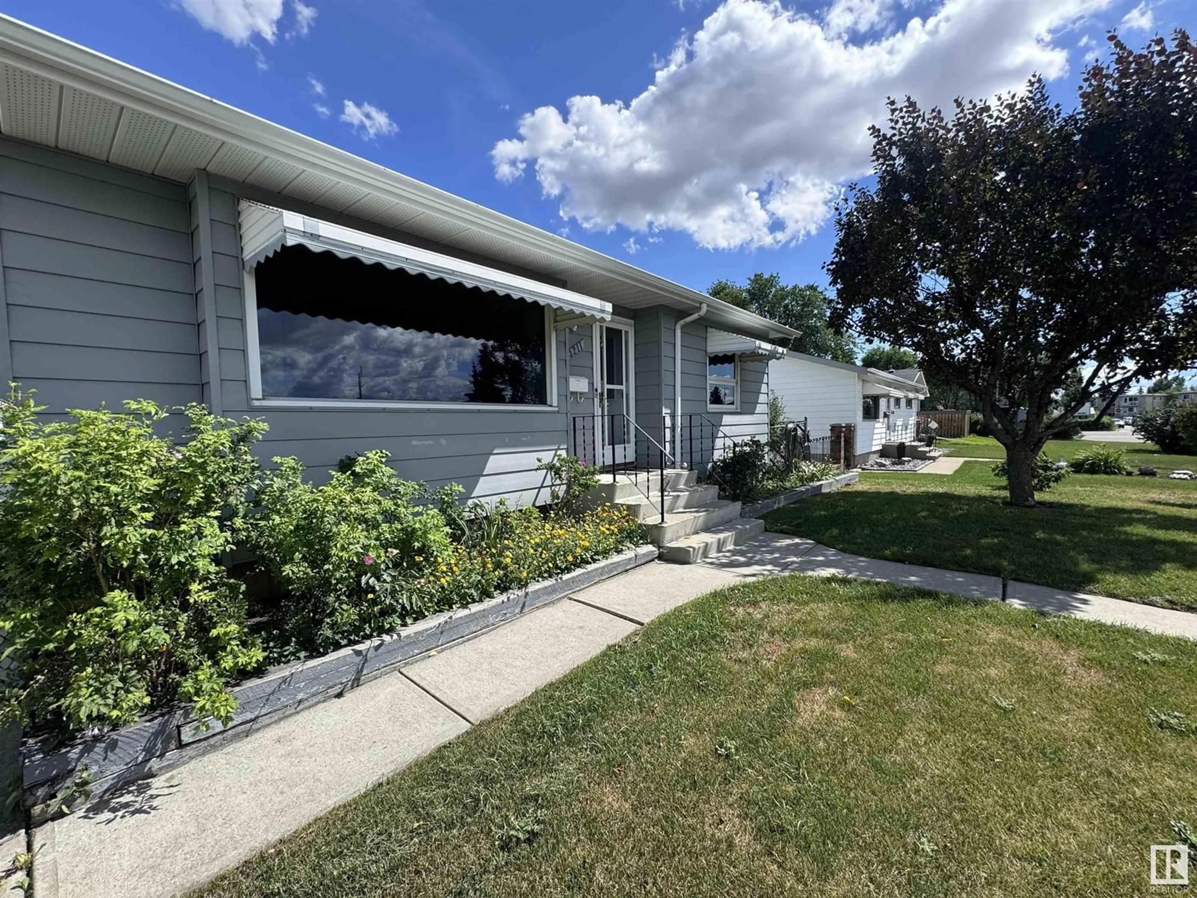 Frontside or backside of a home for 13211 68 ST NW, Edmonton Alberta T5C0G1