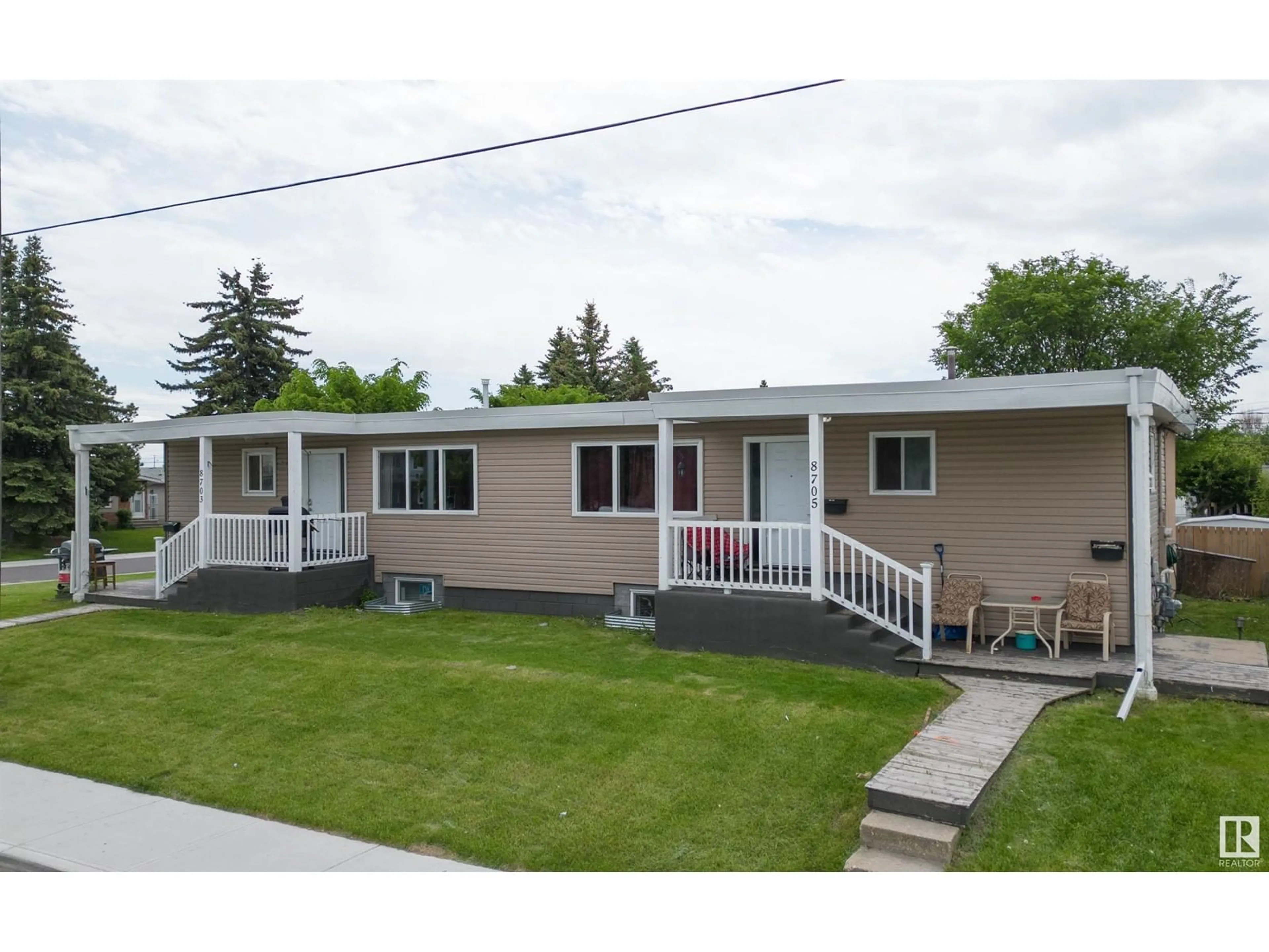 Frontside or backside of a home for 8703-8705 128 AV NW, Edmonton Alberta T5E0G4