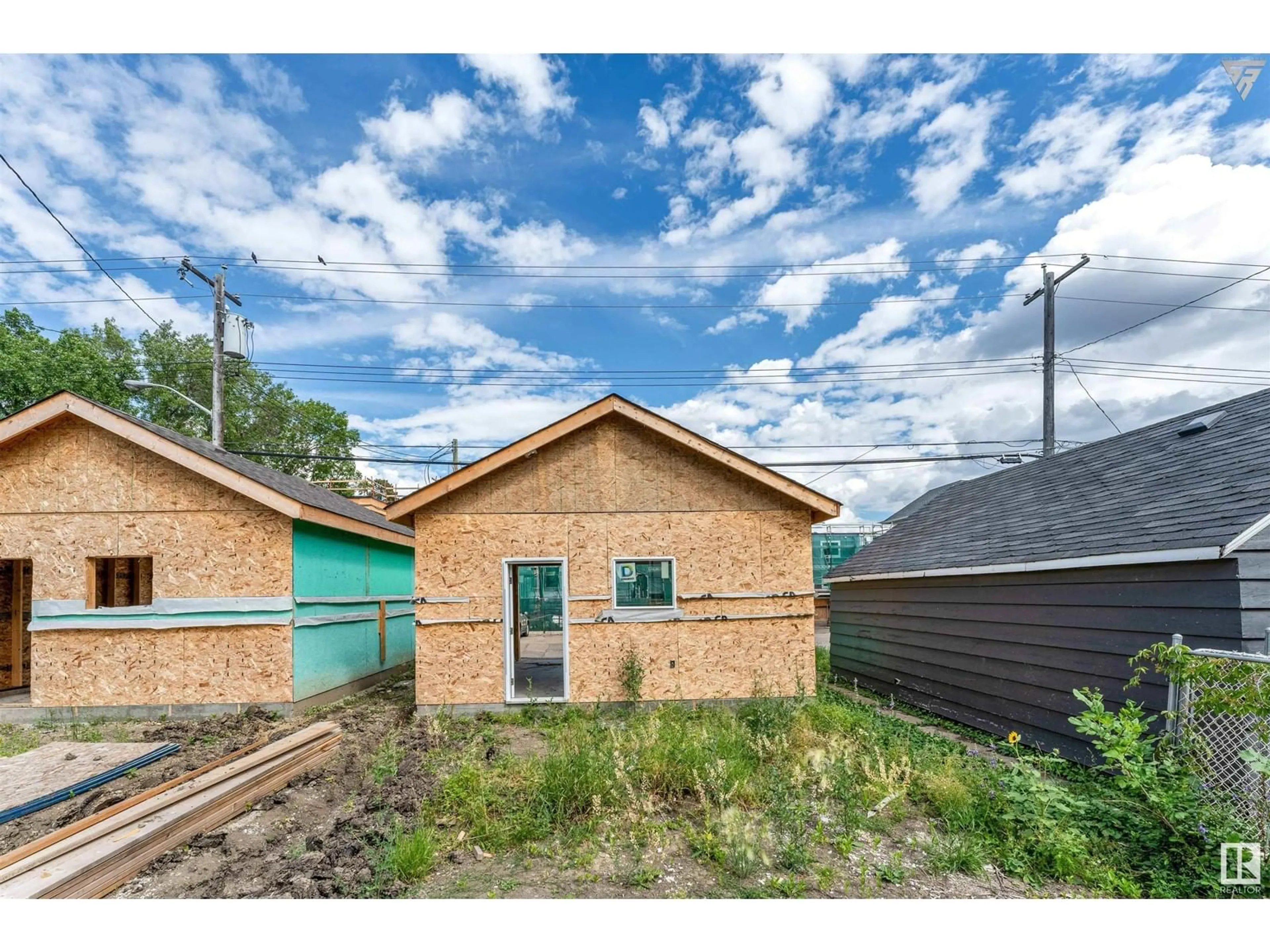 Frontside or backside of a home, the fenced backyard for 11017 125ST NW, Edmonton Alberta T5M0M2