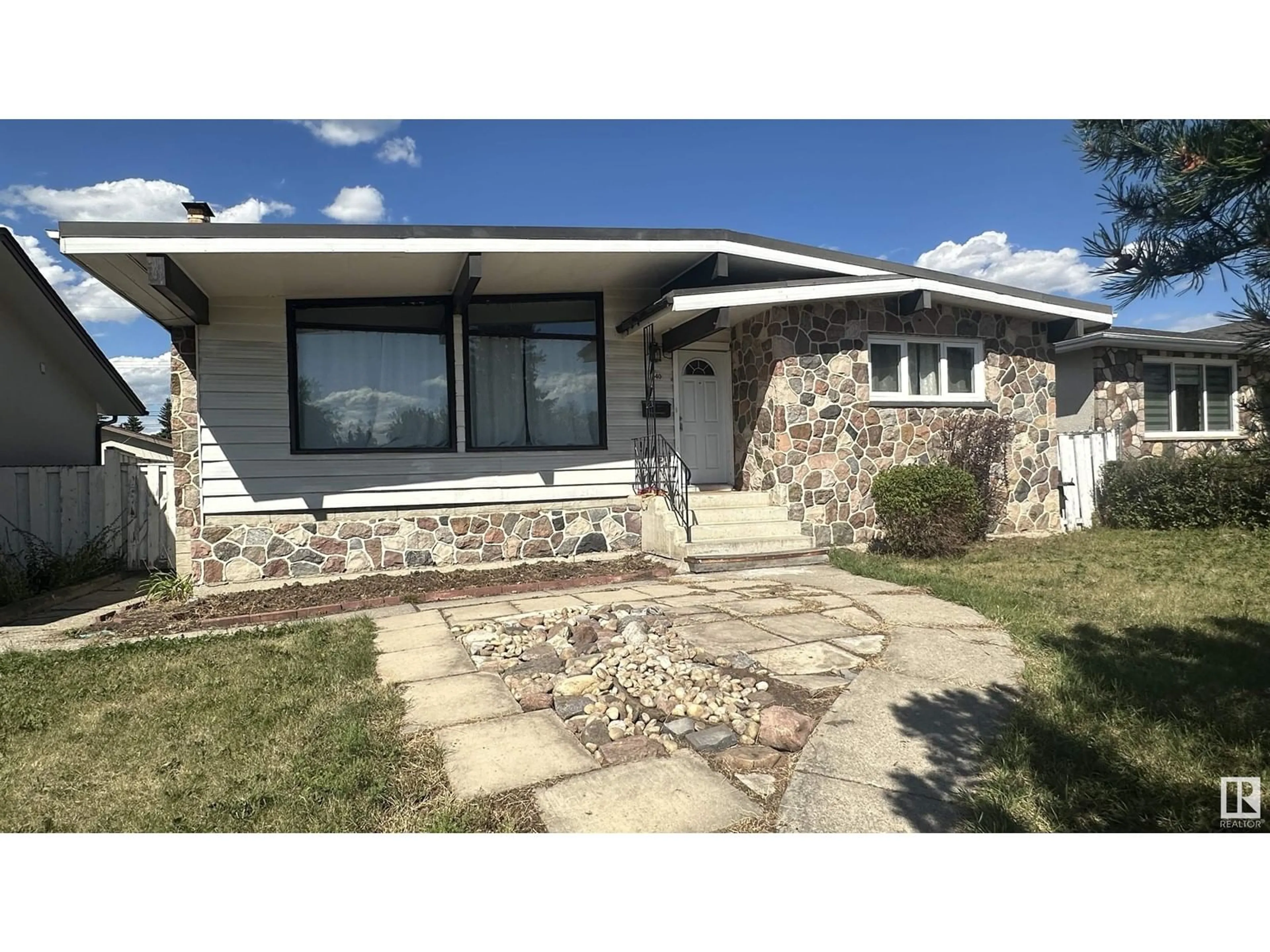 Frontside or backside of a home for 11540 42 AV NW, Edmonton Alberta T6J0W5