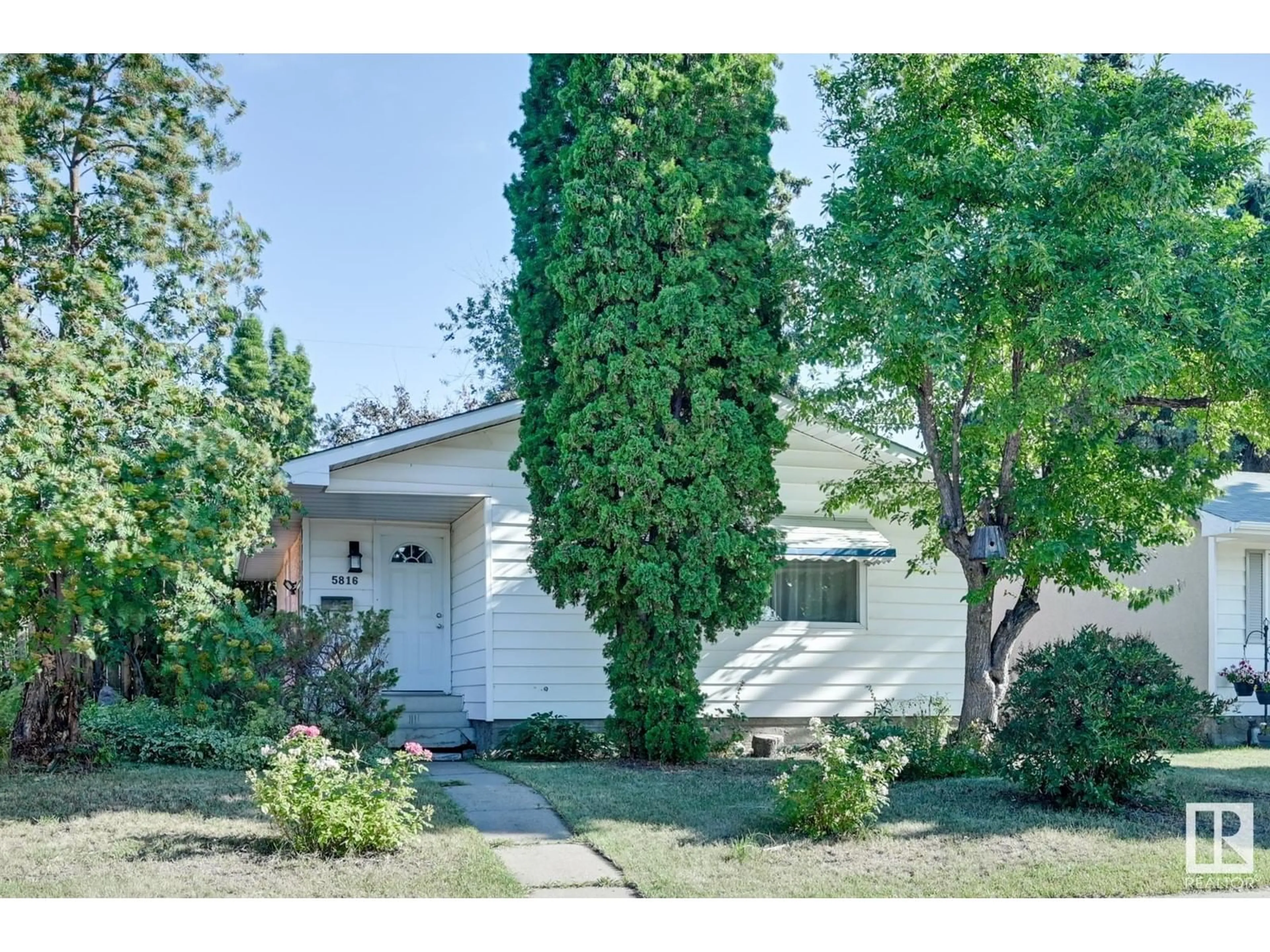 Frontside or backside of a home for 5816 140 AV NW, Edmonton Alberta T5A1G5