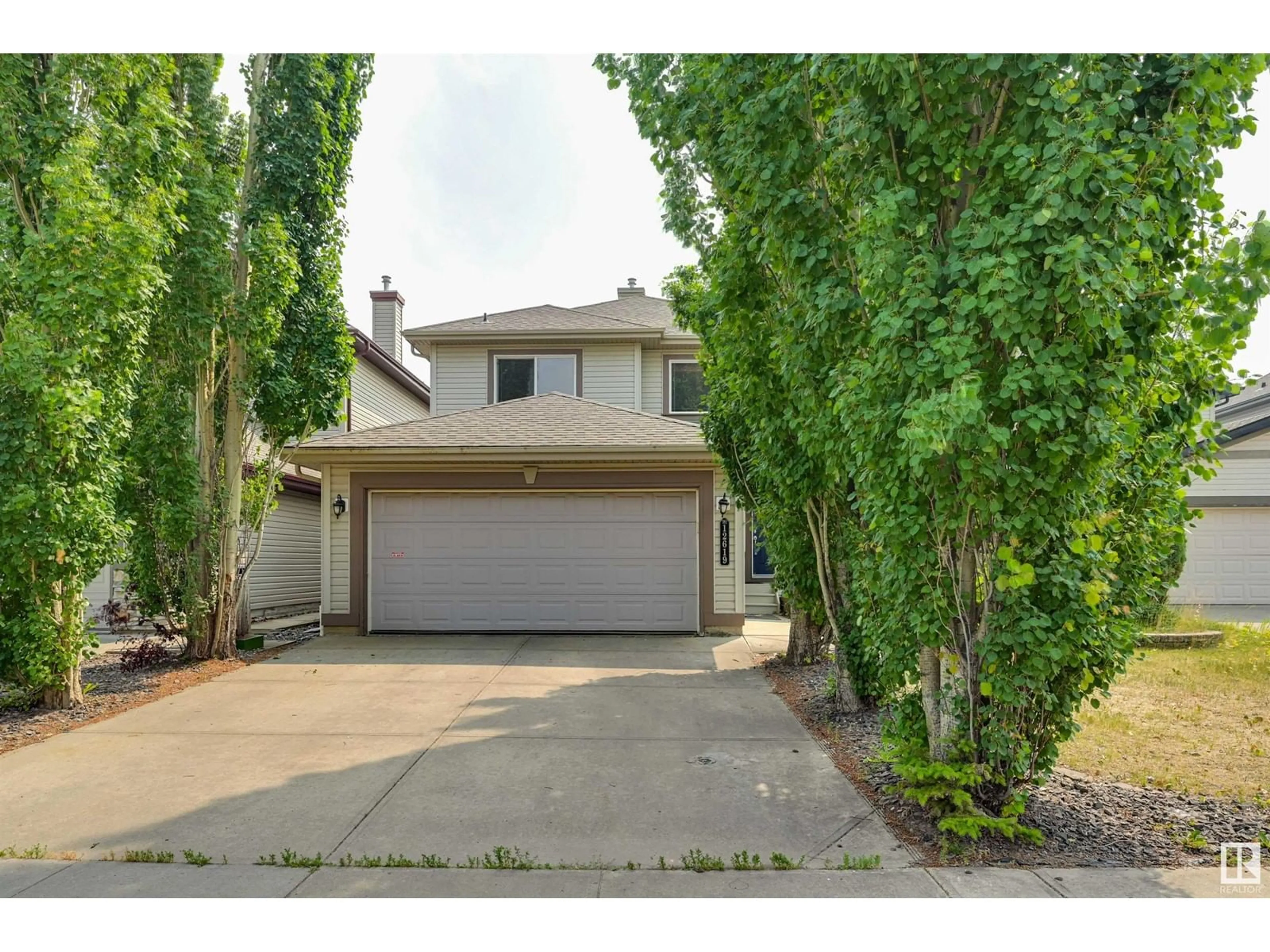 Frontside or backside of a home for 12619 17 AV SW, Edmonton Alberta T6W1R8