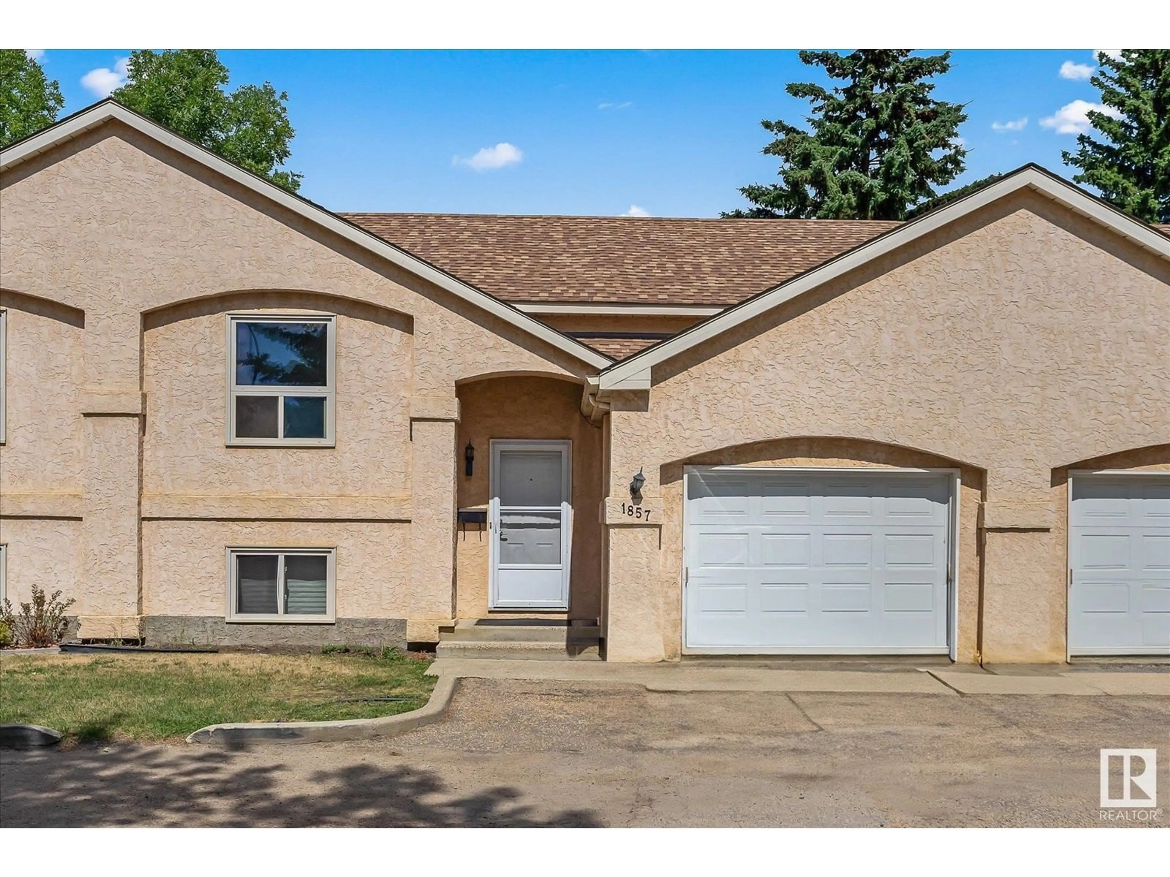 Frontside or backside of a home for 1857 MILL WOODS RD E NW, Edmonton Alberta T6L6K2