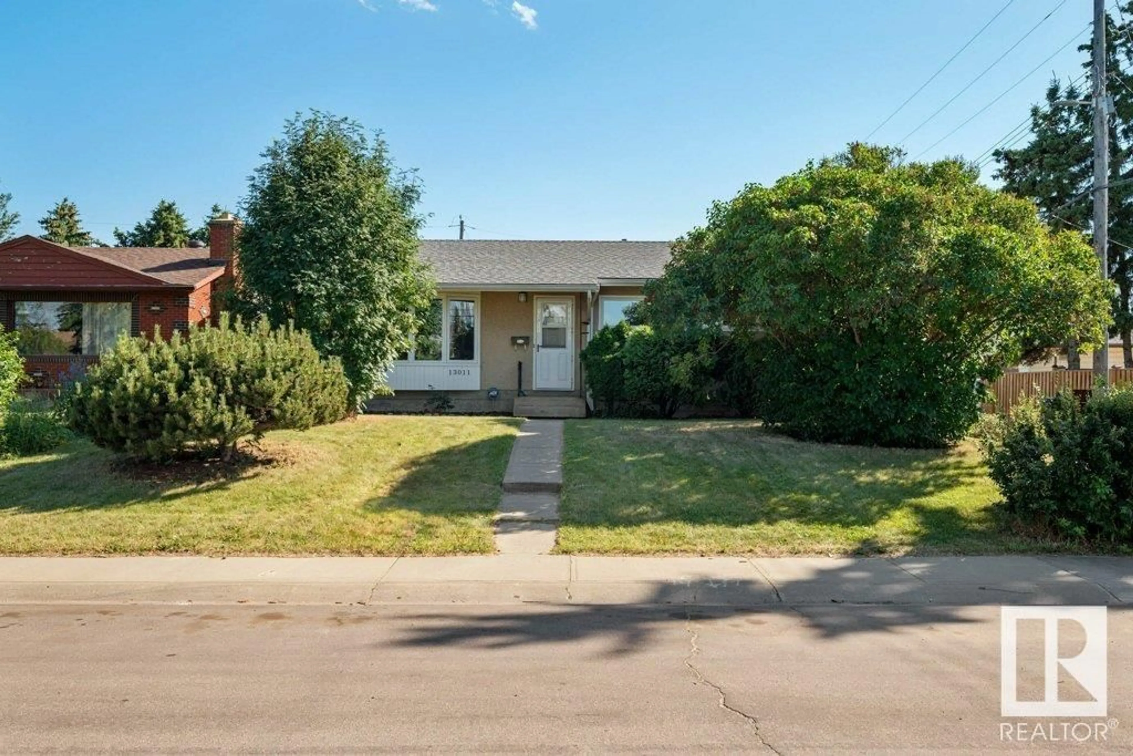 Frontside or backside of a home for 13011 135a AV NW, Edmonton Alberta T5L3Z6