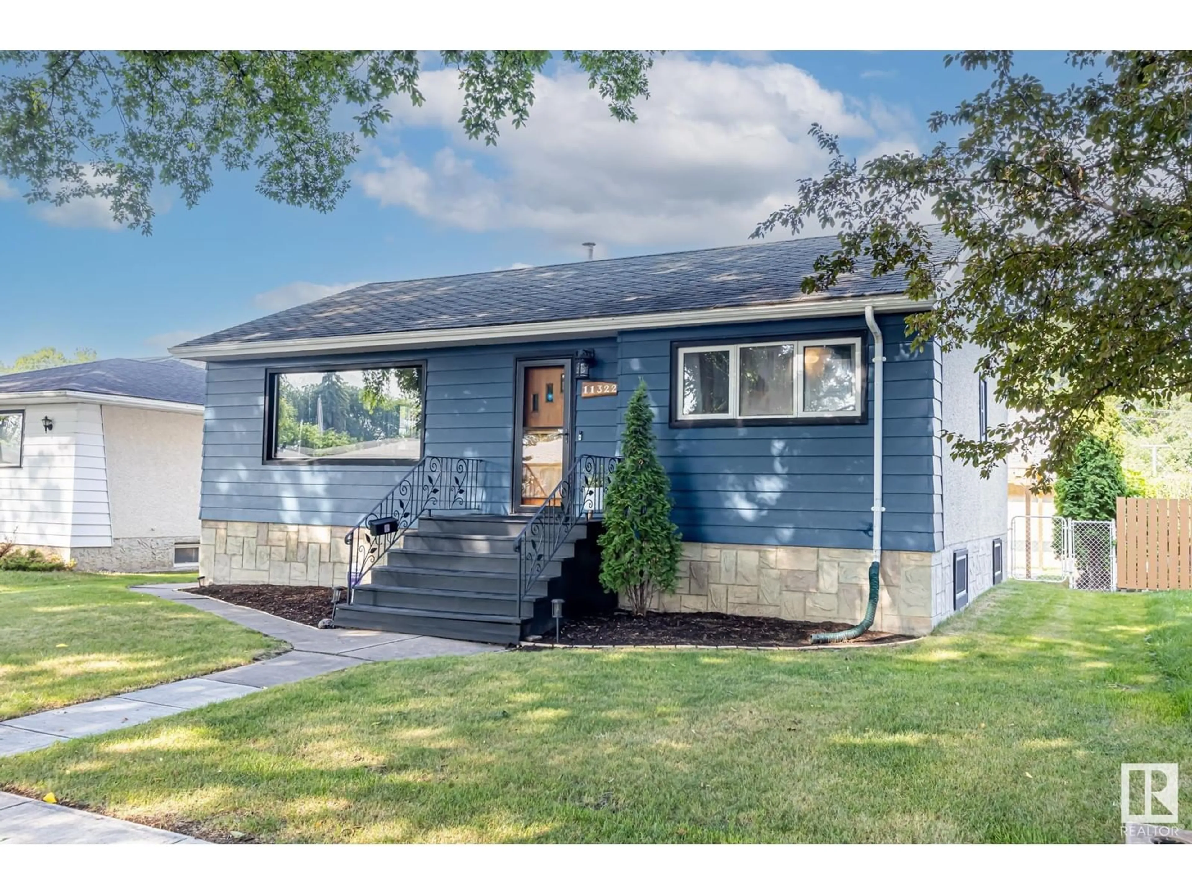 Frontside or backside of a home, cottage for 11322 51 ST NW, Edmonton Alberta T5W3E9