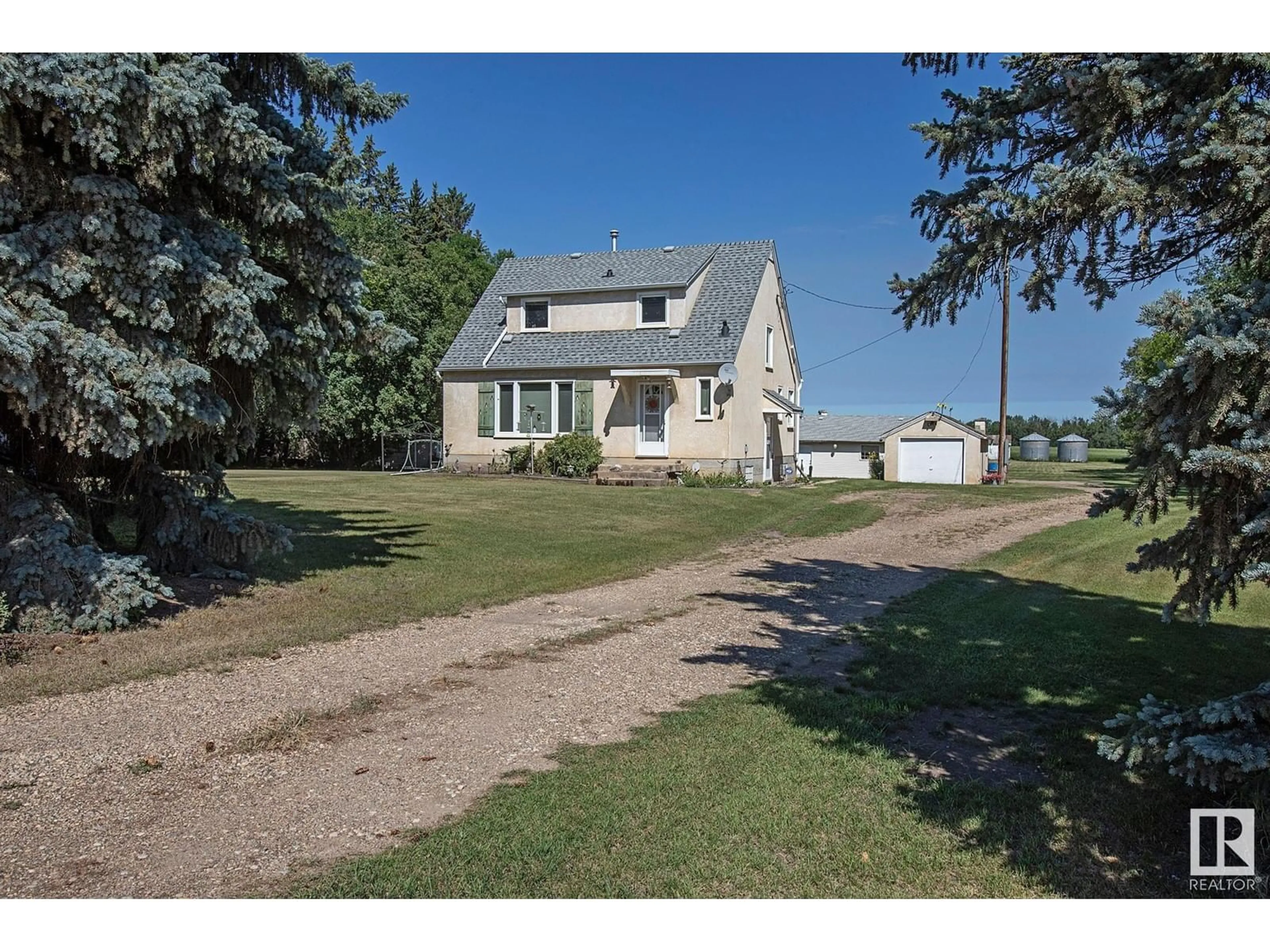 A pic from outside/outdoor area/front of a property/back of a property/a pic from drone, street for 1 24430 TWP RD 552, Rural Sturgeon County Alberta T8T1P7