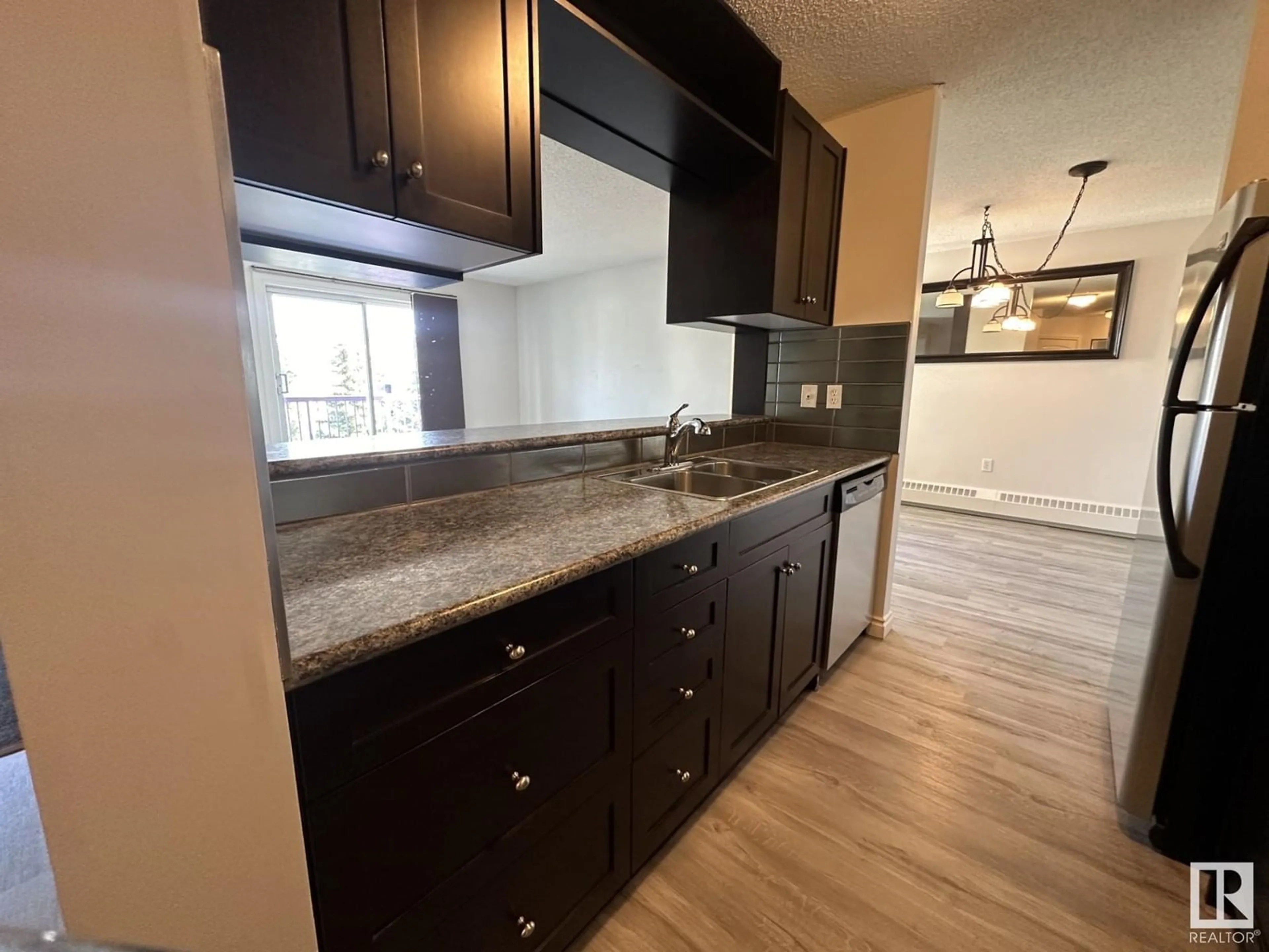 Standard kitchen, wood floors for #446 10636 120 ST NW, Edmonton Alberta T5H4L5