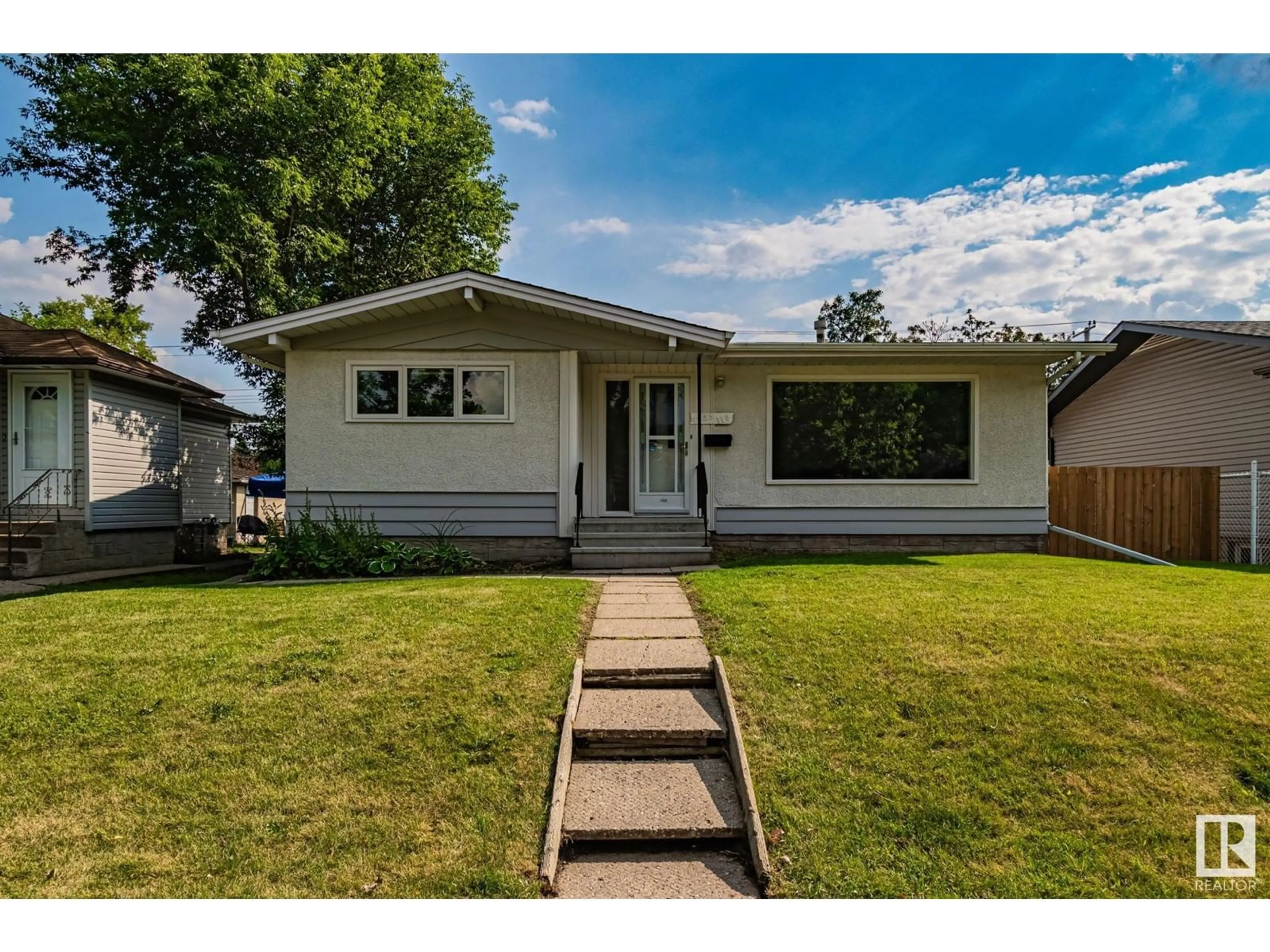 Frontside or backside of a home for 4025 114 AV NW, Edmonton Alberta T5W0S9