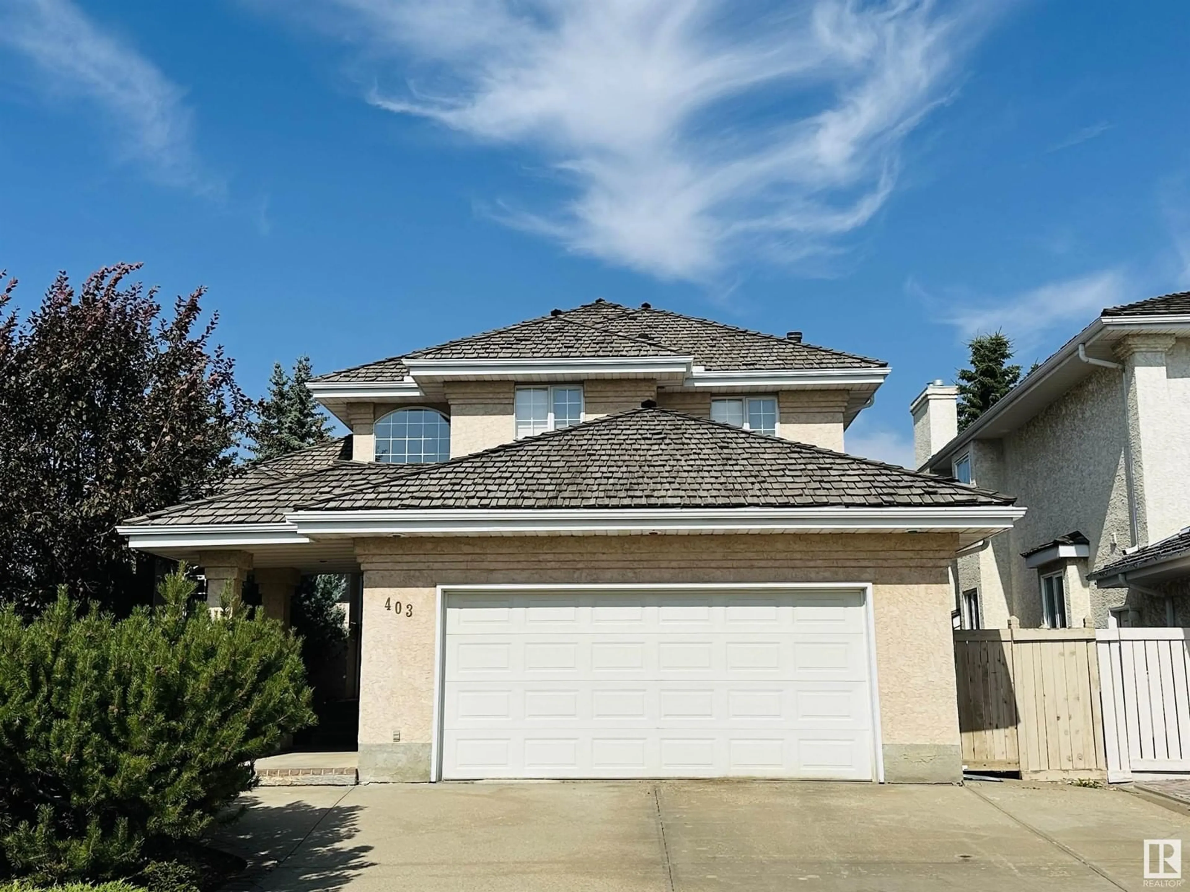 Frontside or backside of a home, the street view for 403 TWIN BROOKS CR NW, Edmonton Alberta T6J6V2