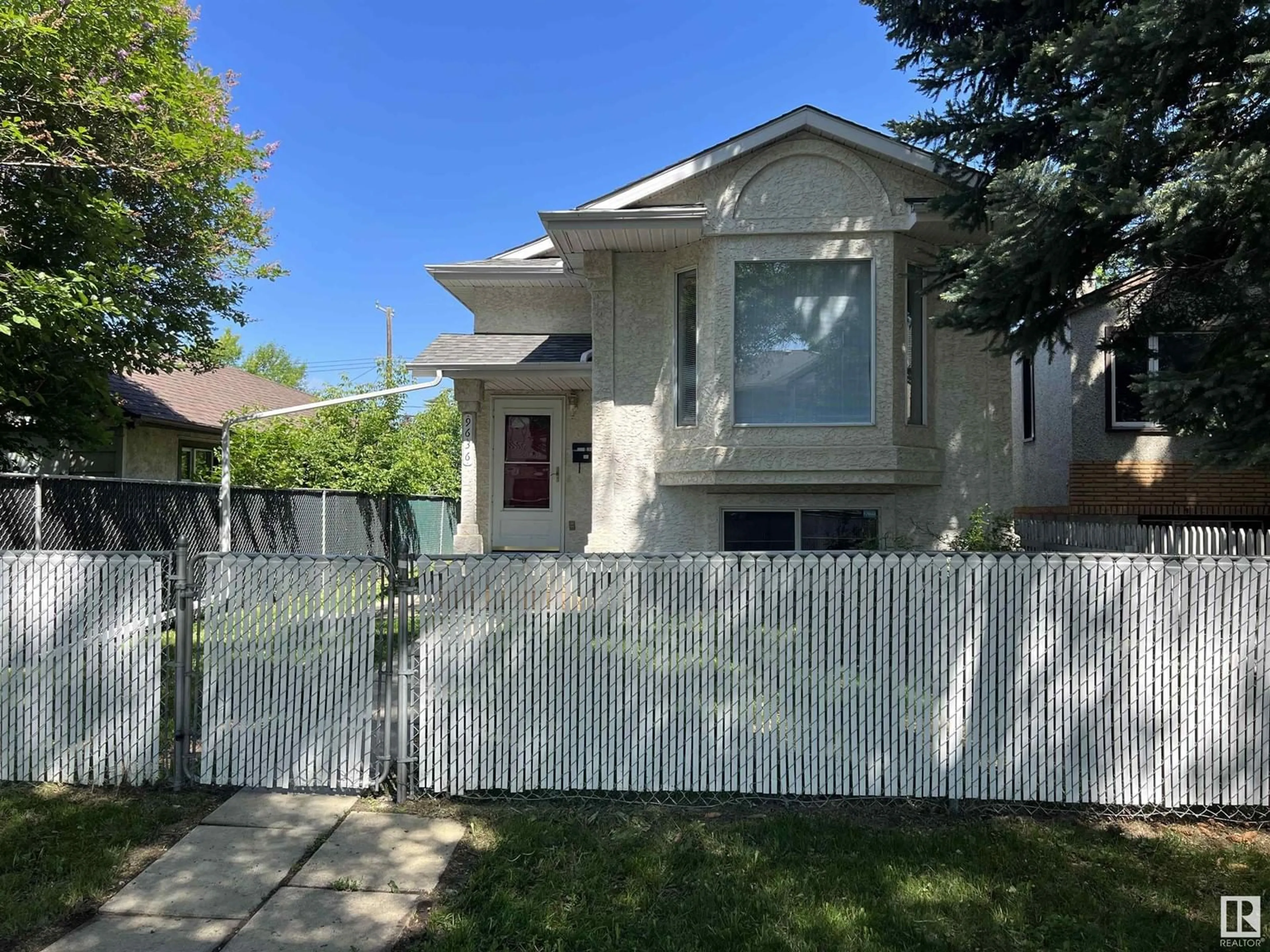 Frontside or backside of a home for 9636 73 AV NW, Edmonton Alberta T6E1B2