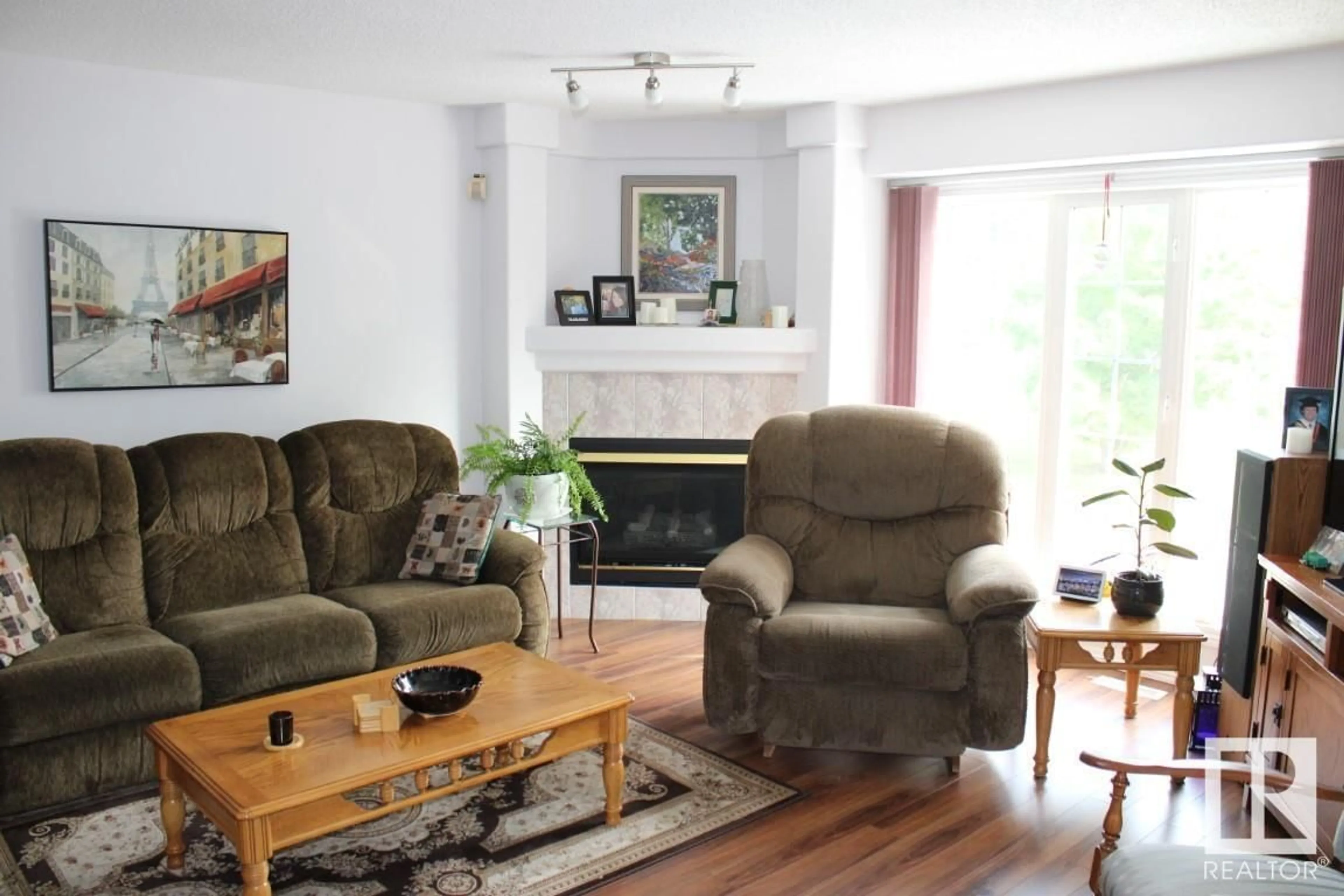 Living room, wood floors for #55 2419 133 AV NW NW, Edmonton Alberta T5A5A5