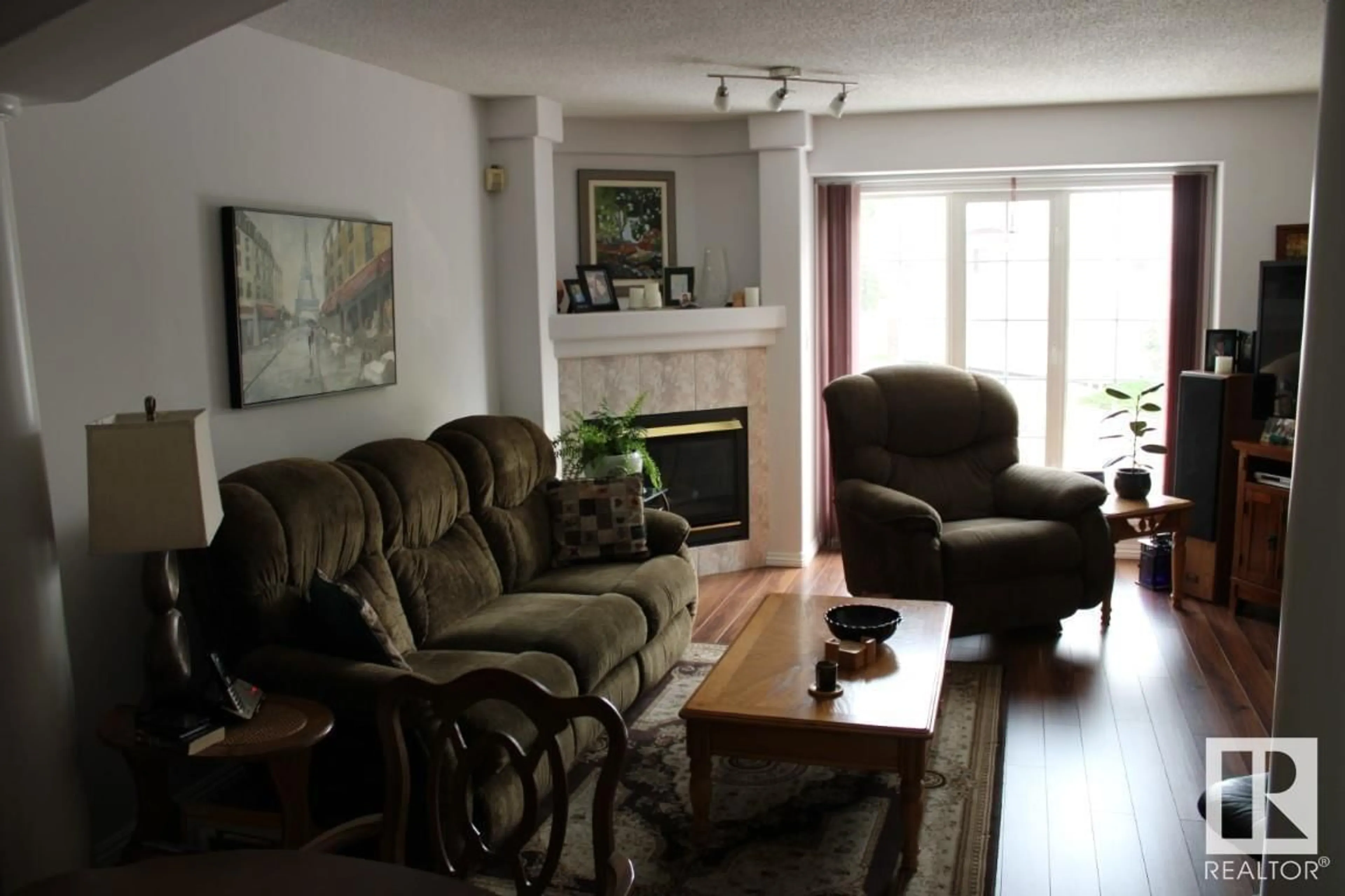 Living room, wood floors for #55 2419 133 AV NW NW, Edmonton Alberta T5A5A5