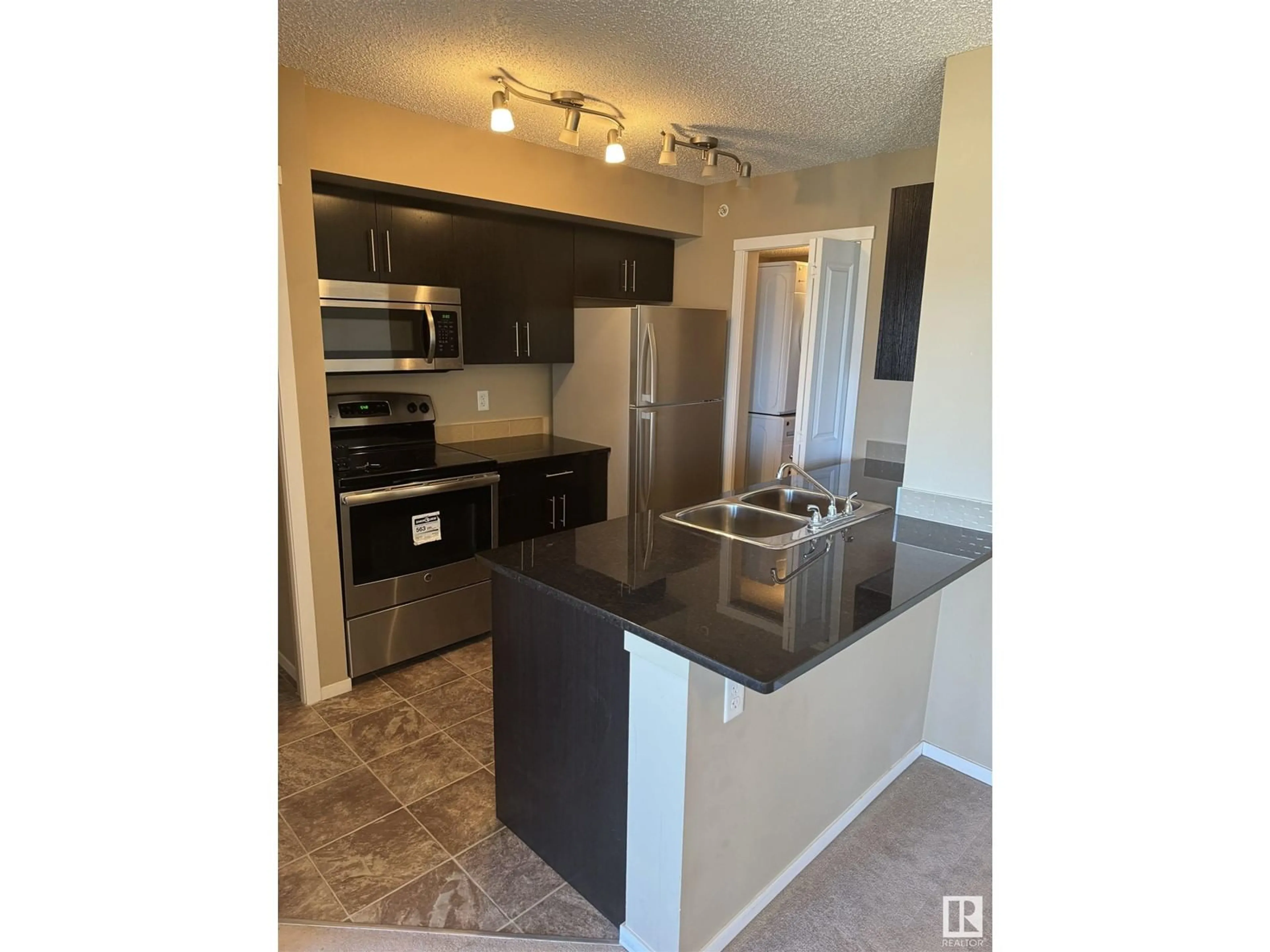 Standard kitchen, wood floors for #413 5810 MULLEN PLACE PL NW, Edmonton Alberta T6R0W3