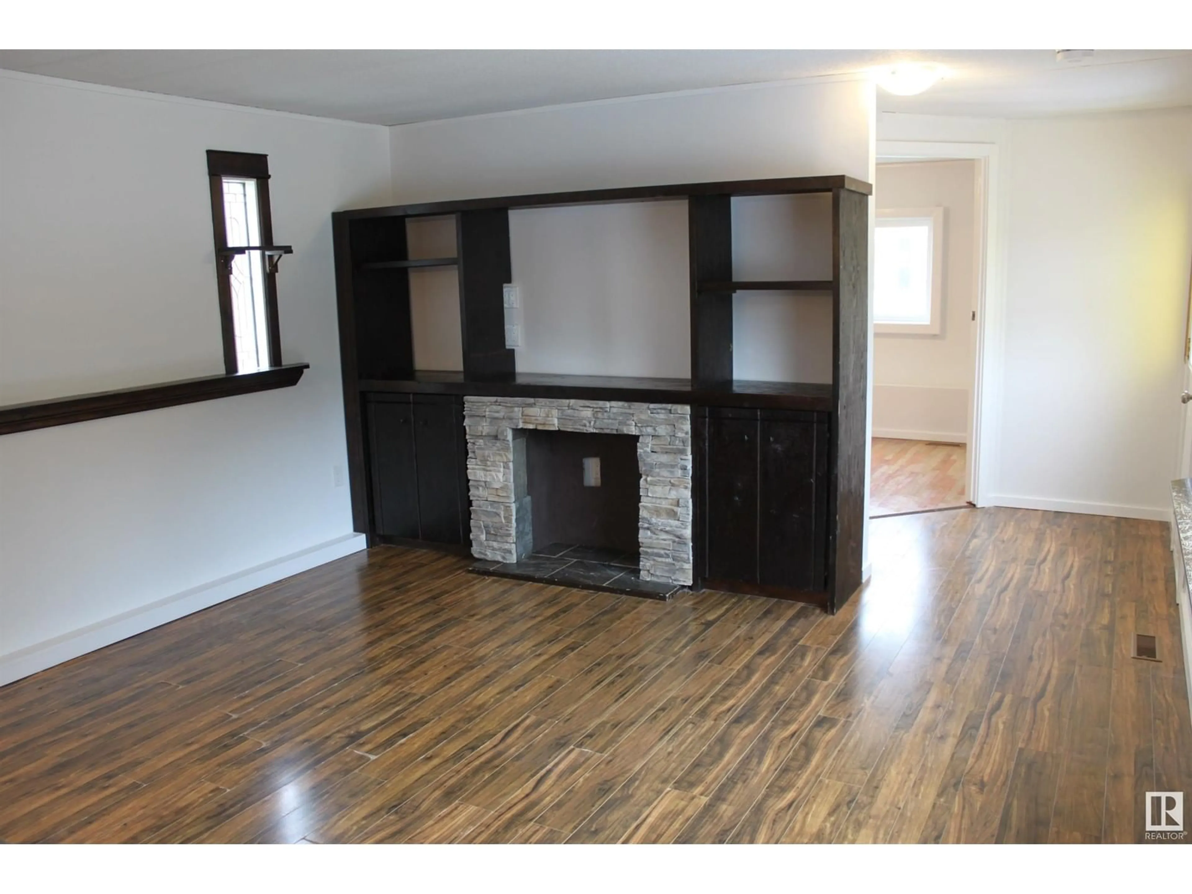 Living room, wood floors for #16 5407 52A St., Tofield Alberta T0B4J0