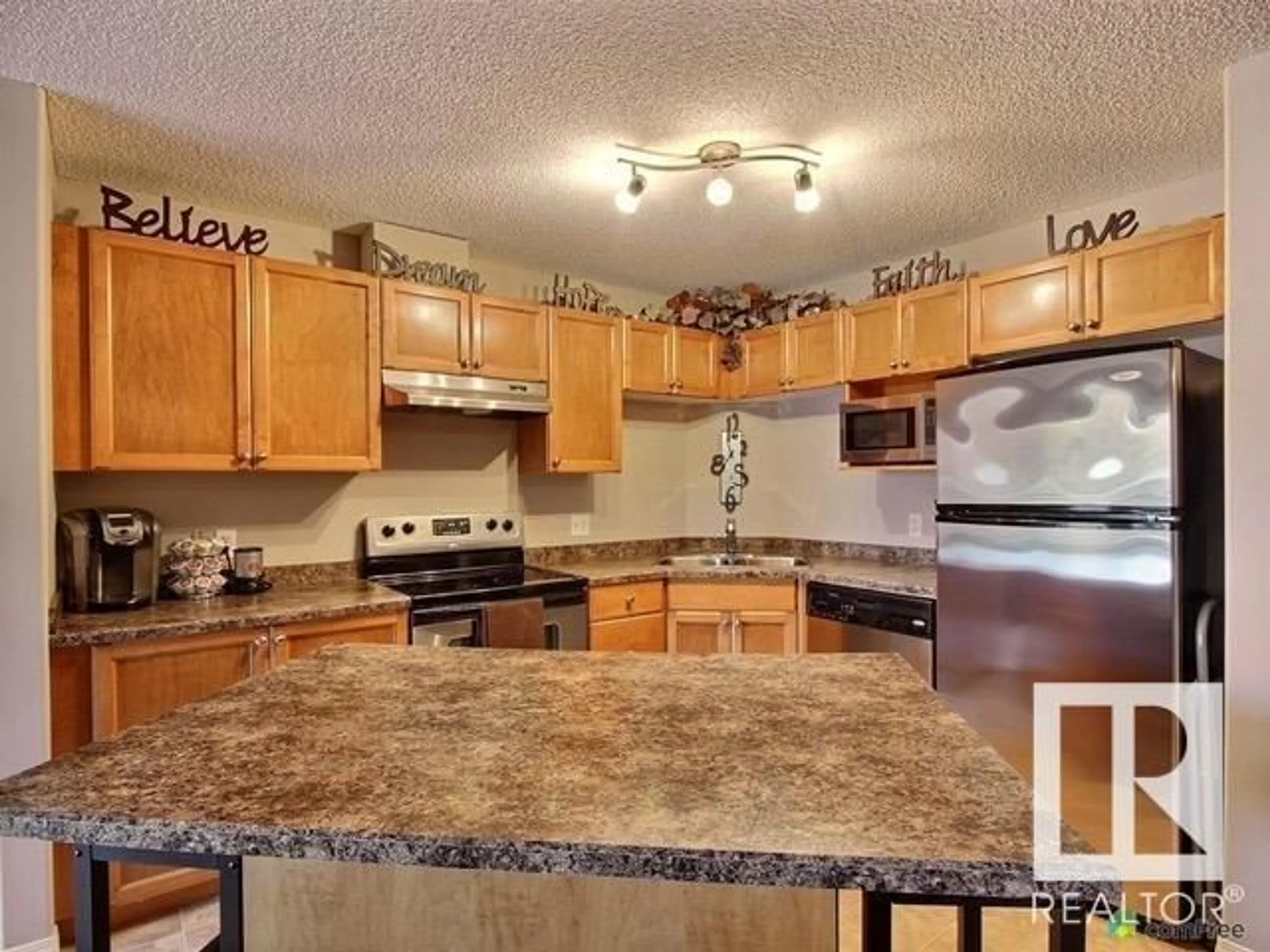 Standard kitchen, wood floors, cottage for #1430 330 CLAREVIEW STATION DR NW, Edmonton Alberta T5Y0E6