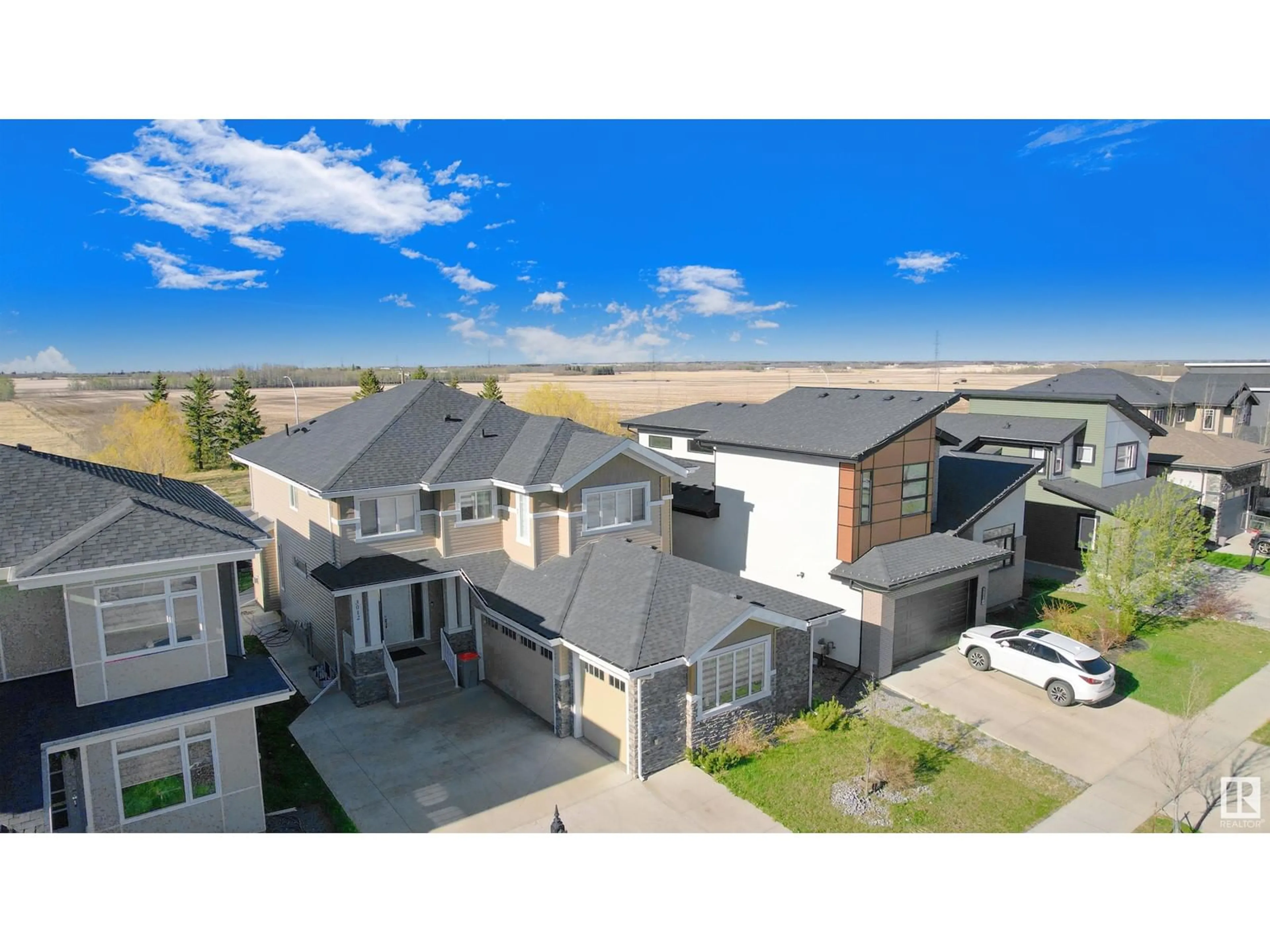 A pic from exterior of the house or condo, the street view for 3012 58 AV NE, Rural Leduc County Alberta T4X0X9