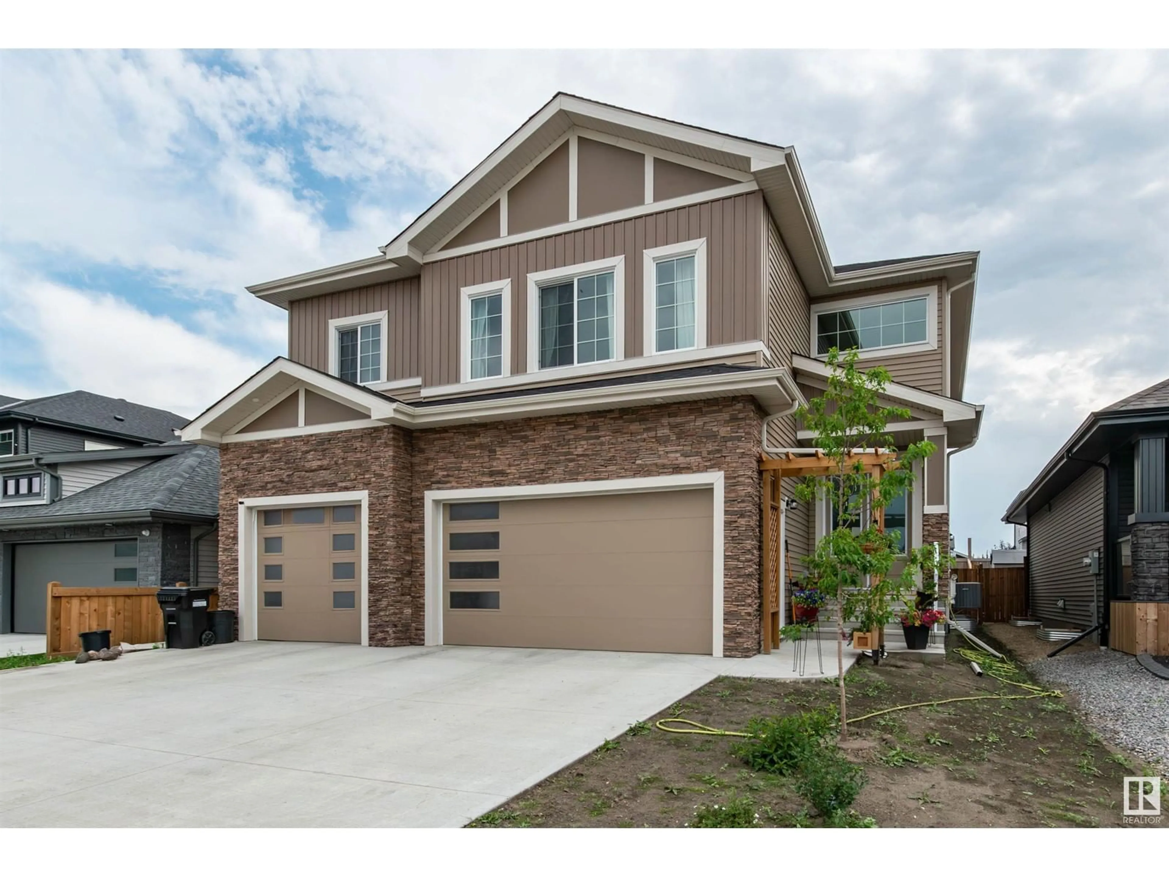 Home with brick exterior material for 65 LILAC BA, Spruce Grove Alberta T7X2H5