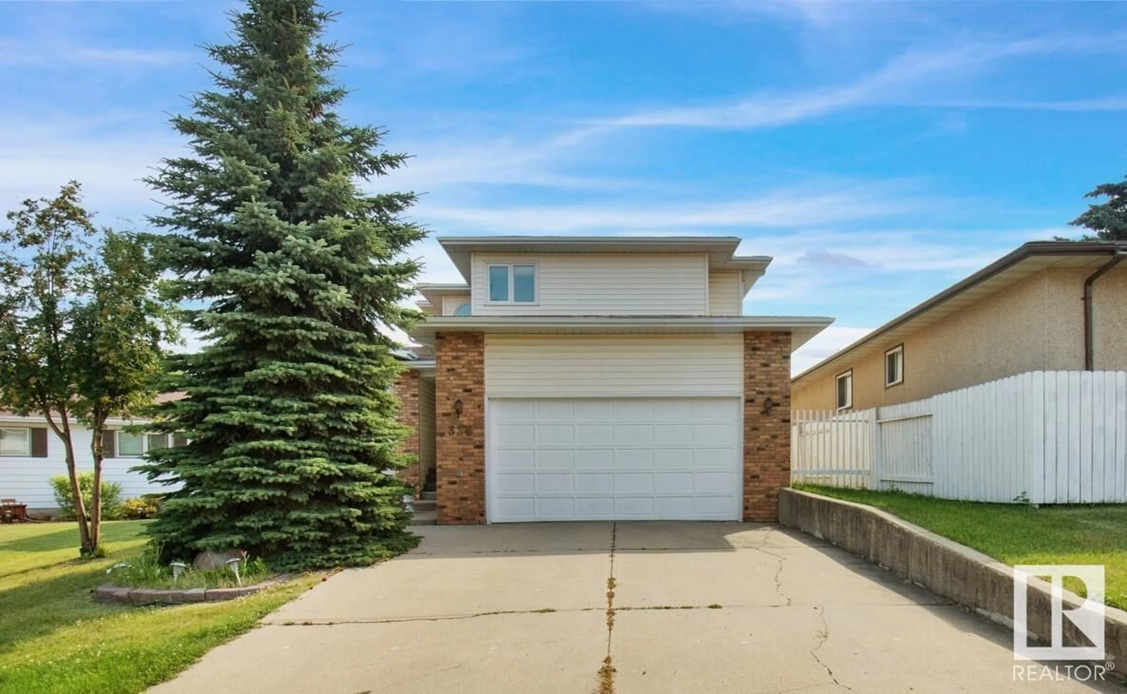 A pic from exterior of the house or condo, the fenced backyard for 336 GRAND MEADOW CR NW, Edmonton Alberta T6L1X2