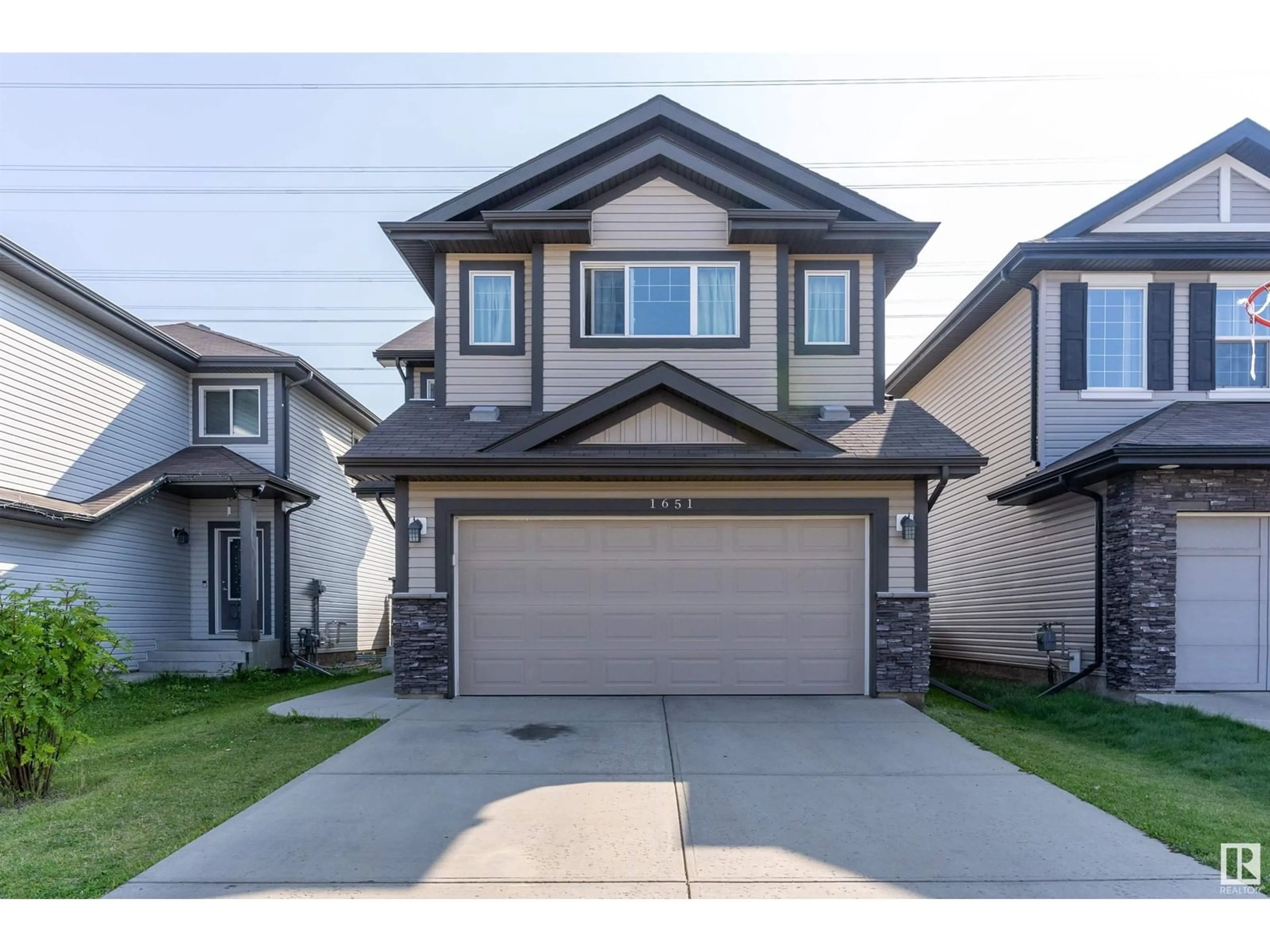 Frontside or backside of a home, the street view for 1651 28 ST NW, Edmonton Alberta T6T0R7