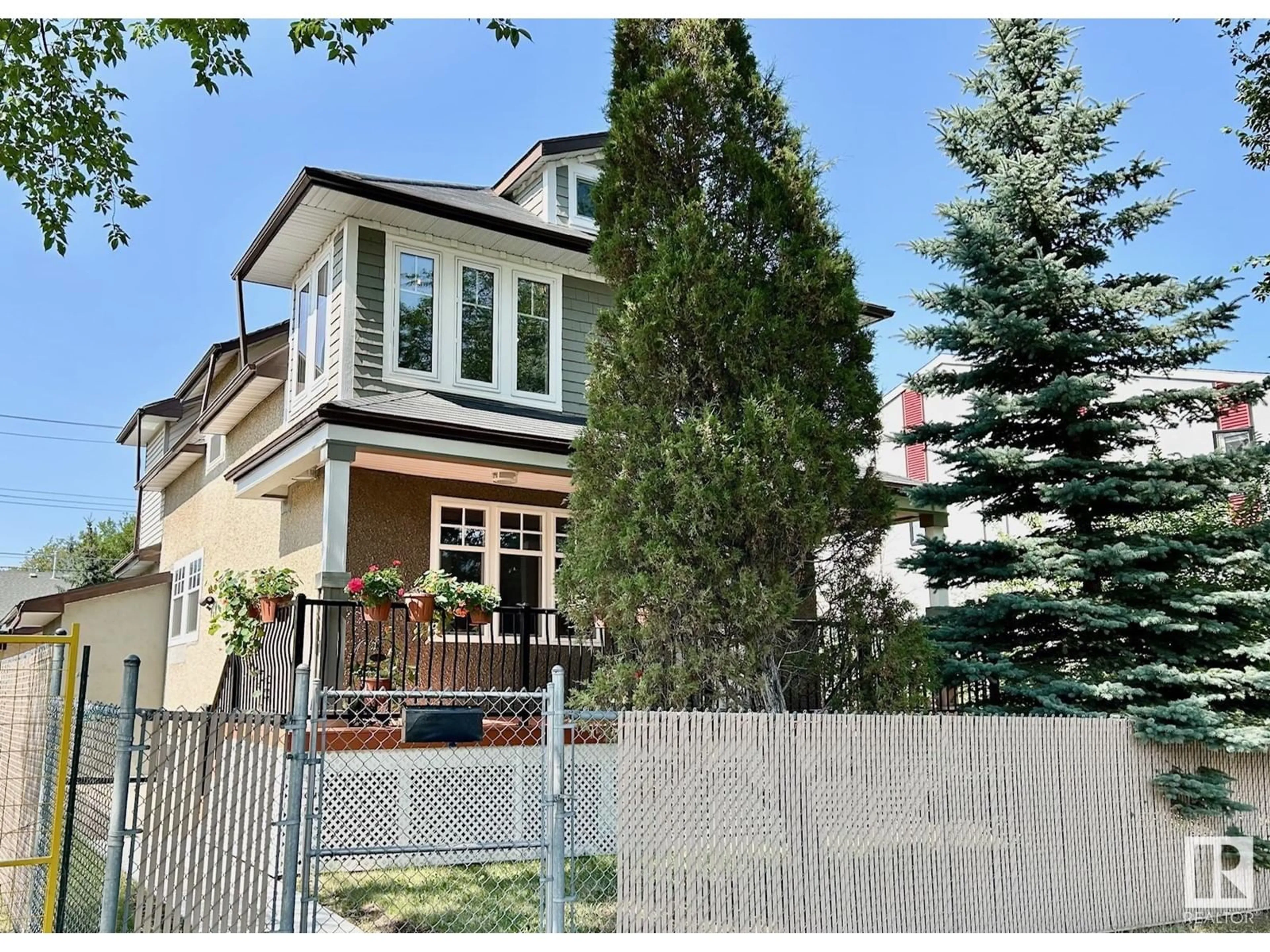 Frontside or backside of a home, the fenced backyard for 11910 76 ST NW, Edmonton Alberta T5B2C7