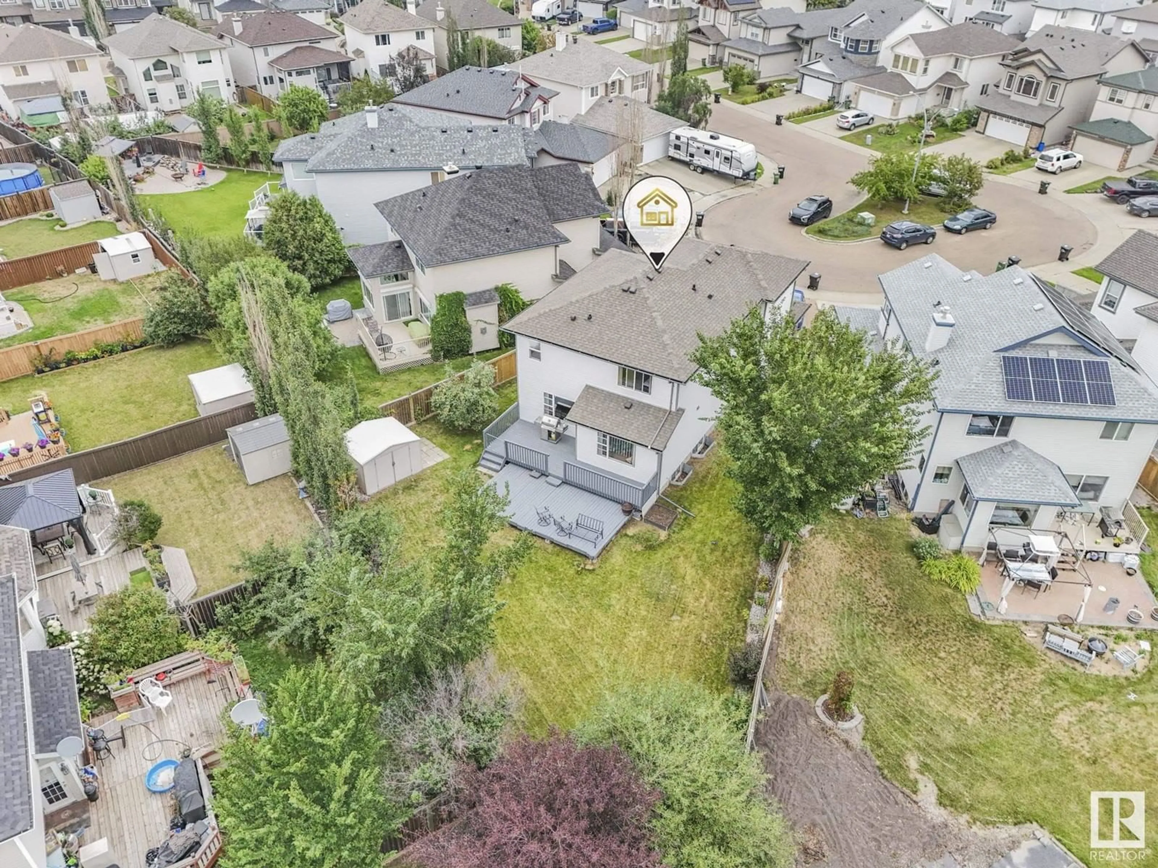 Frontside or backside of a home, the fenced backyard for 14612 137 ST NW, Edmonton Alberta T6V1V2