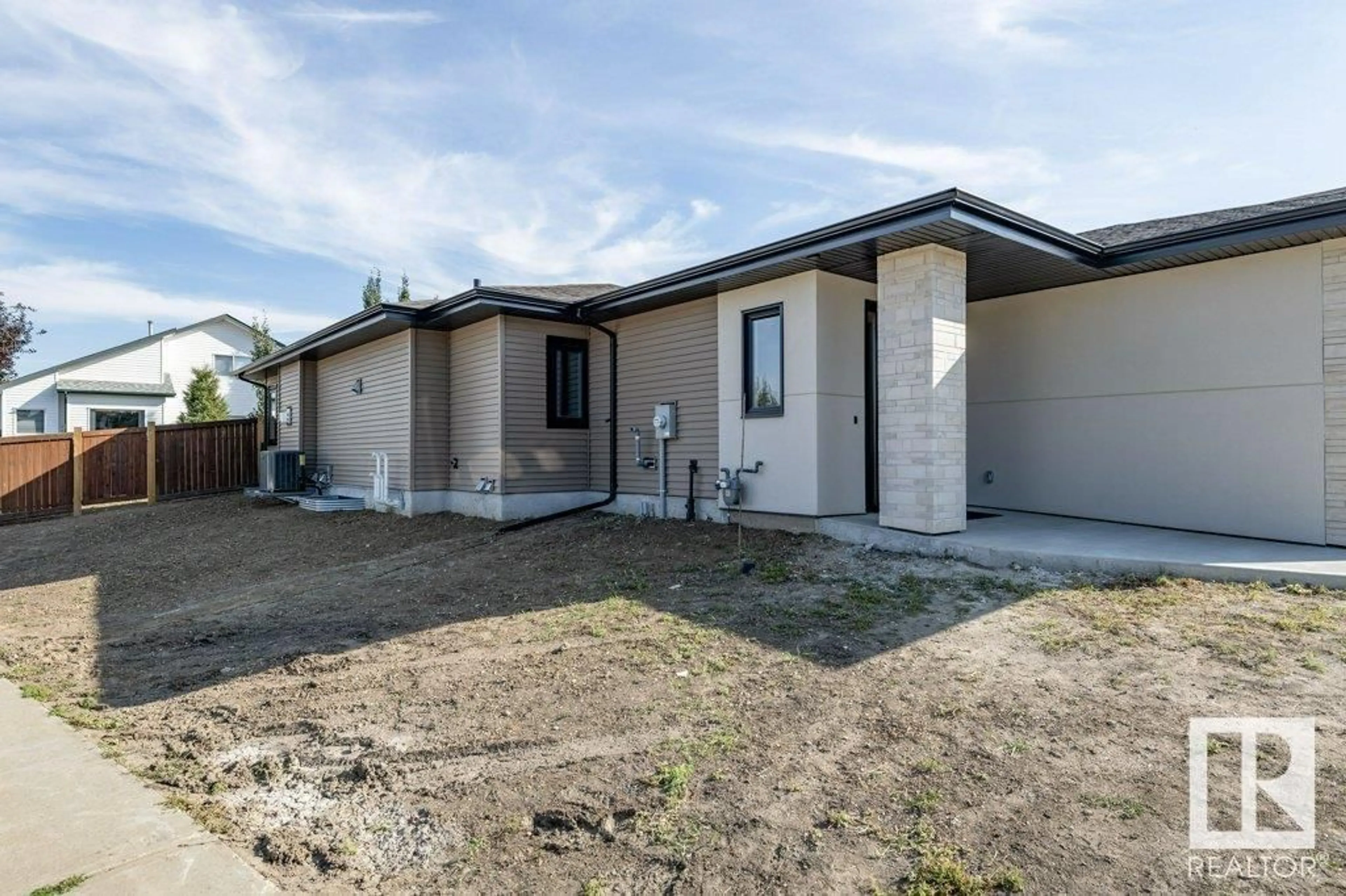 Frontside or backside of a home, the fenced backyard for 661 MEADOWVIEW CR, Sherwood Park Alberta T8H1Y8