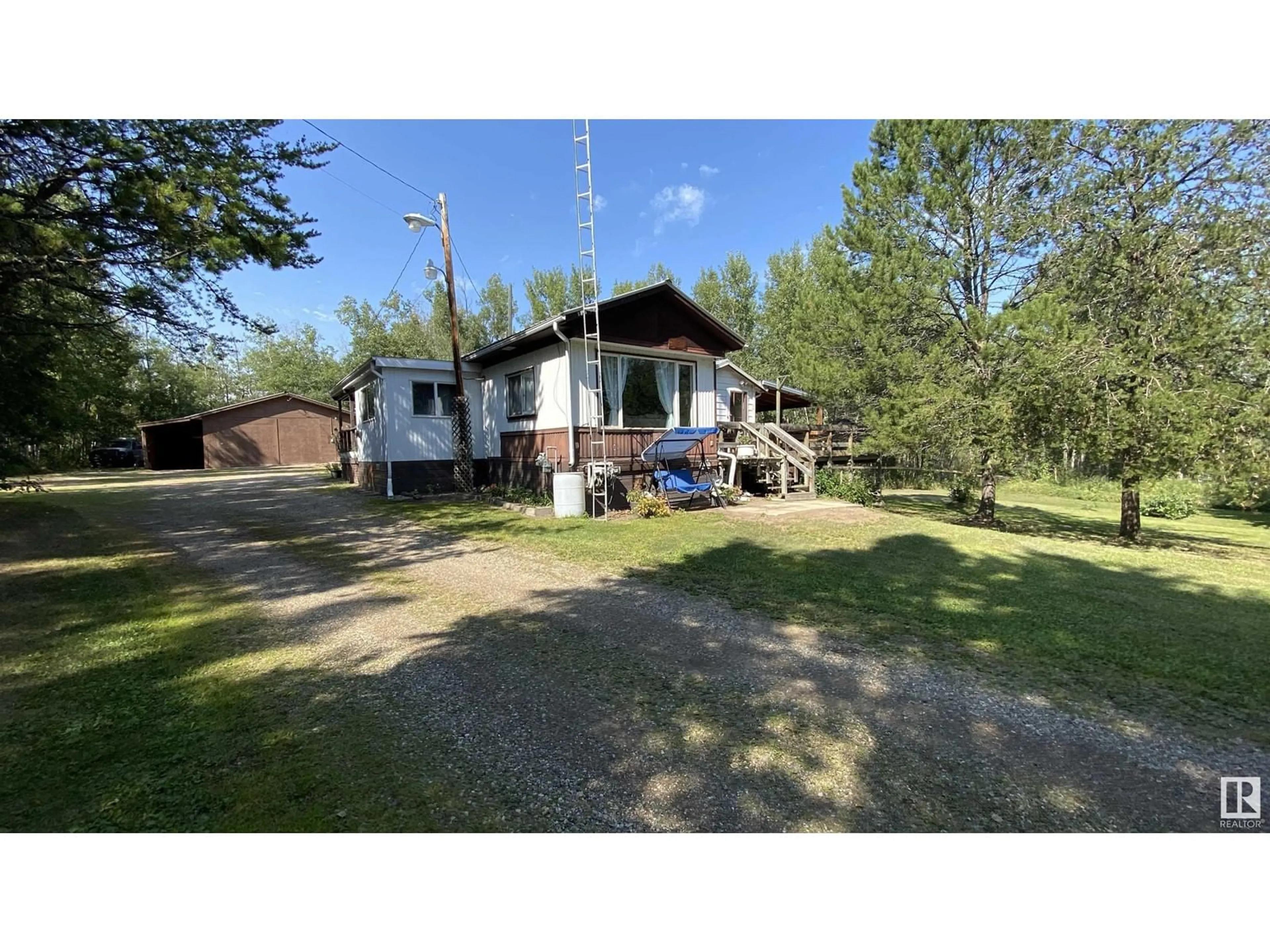 Frontside or backside of a home, cottage for #106 11124 TWP RD 595, Rural St. Paul County Alberta T0A0C0