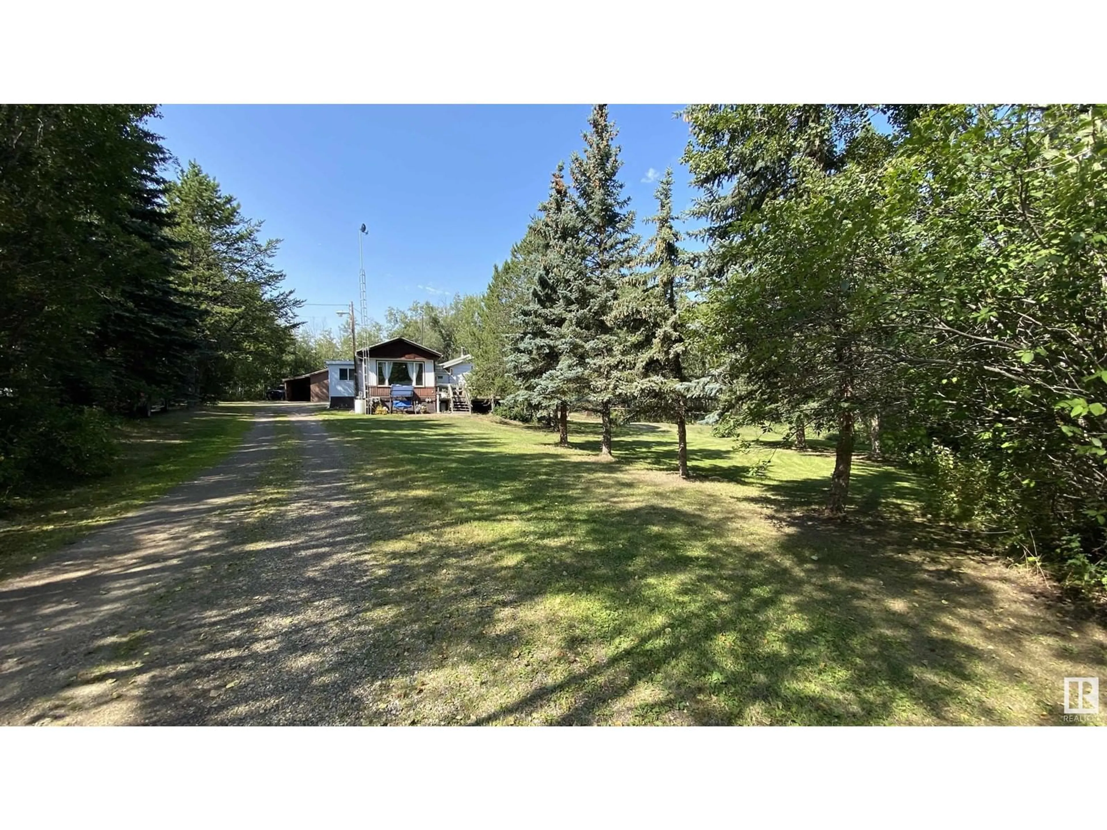 A pic from exterior of the house or condo, the fenced backyard for #106 11124 TWP RD 595, Rural St. Paul County Alberta T0A0C0