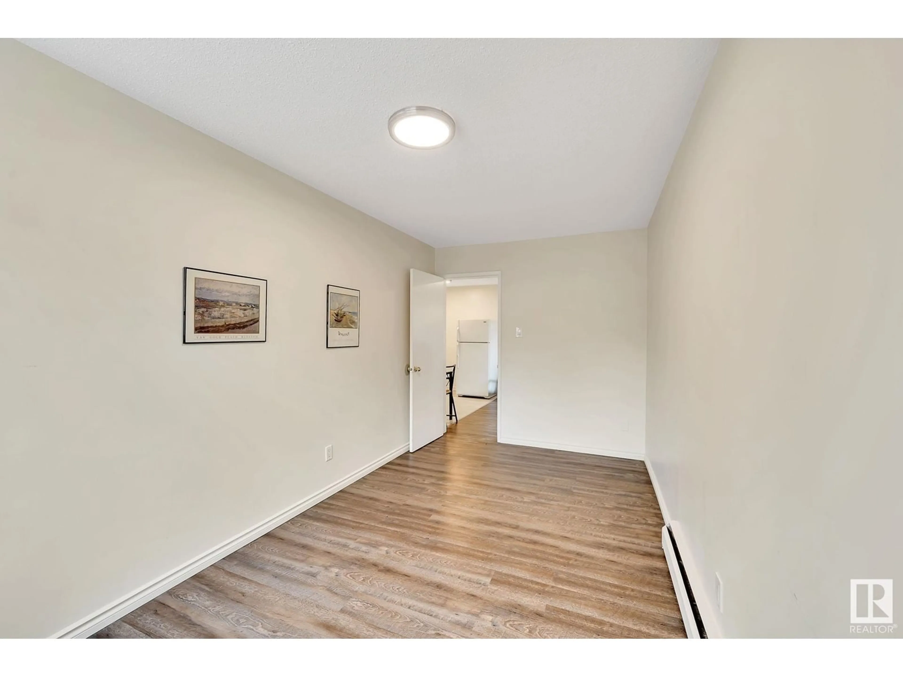 A pic of a room, wood floors for #104 12409 82 ST NW, Edmonton Alberta T5B2X5