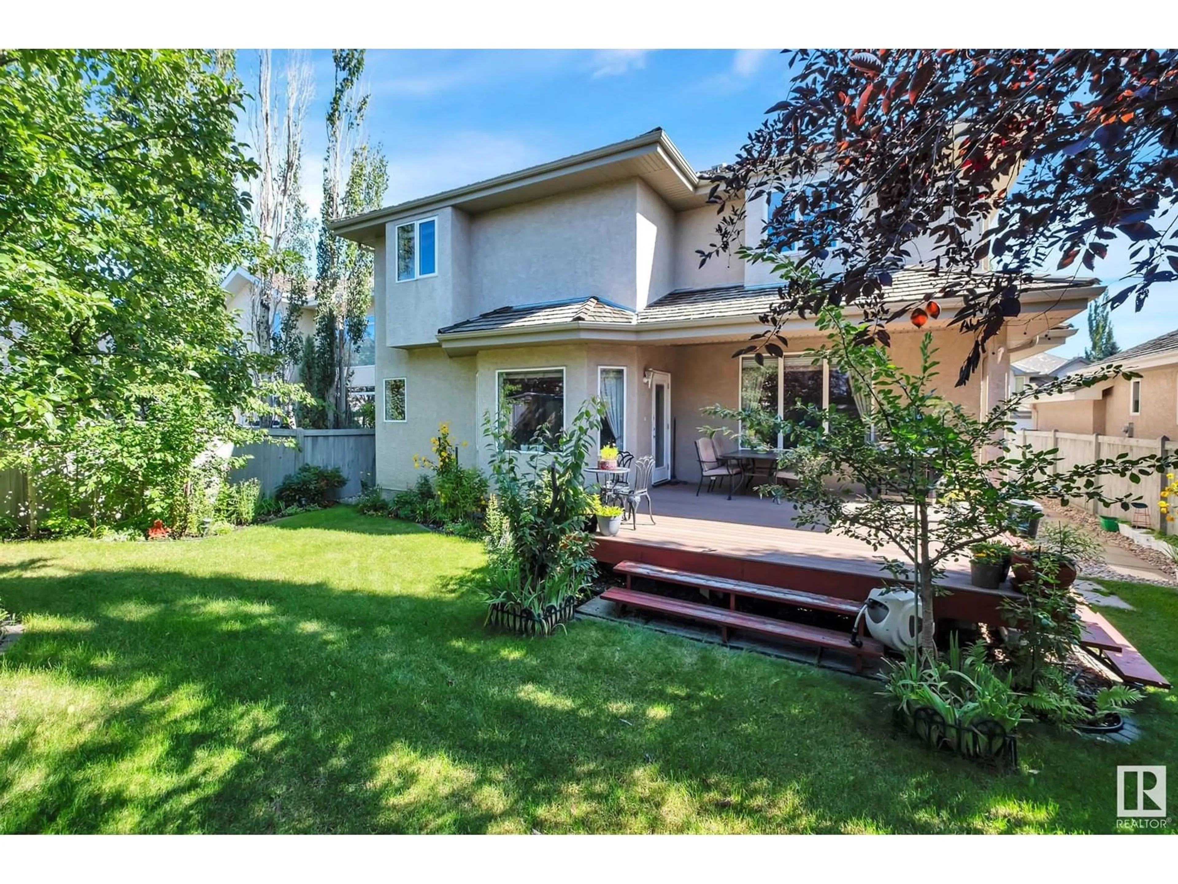 Frontside or backside of a home, the fenced backyard for 1010 DOWNEY WY NW, Edmonton Alberta T6M2V4