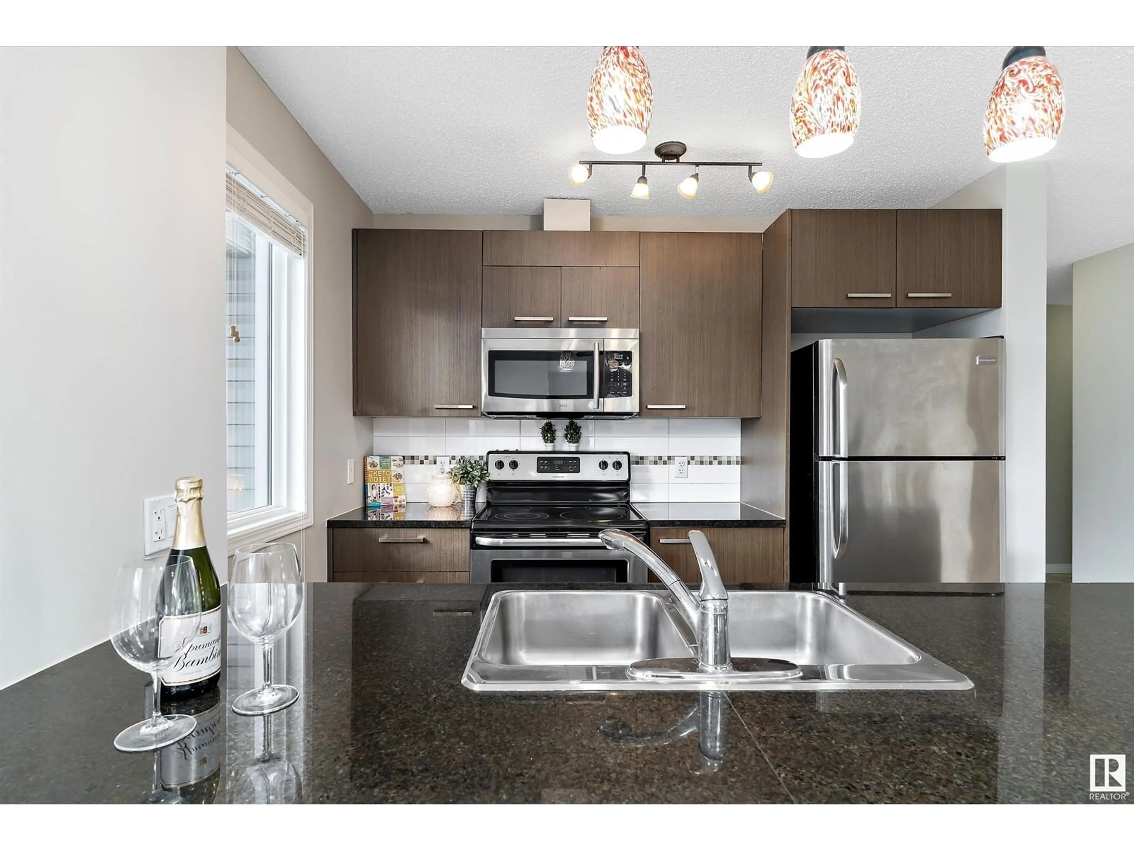 Open concept kitchen for #3218 9351 SIMPSON DR NW, Edmonton Alberta T6R0N4