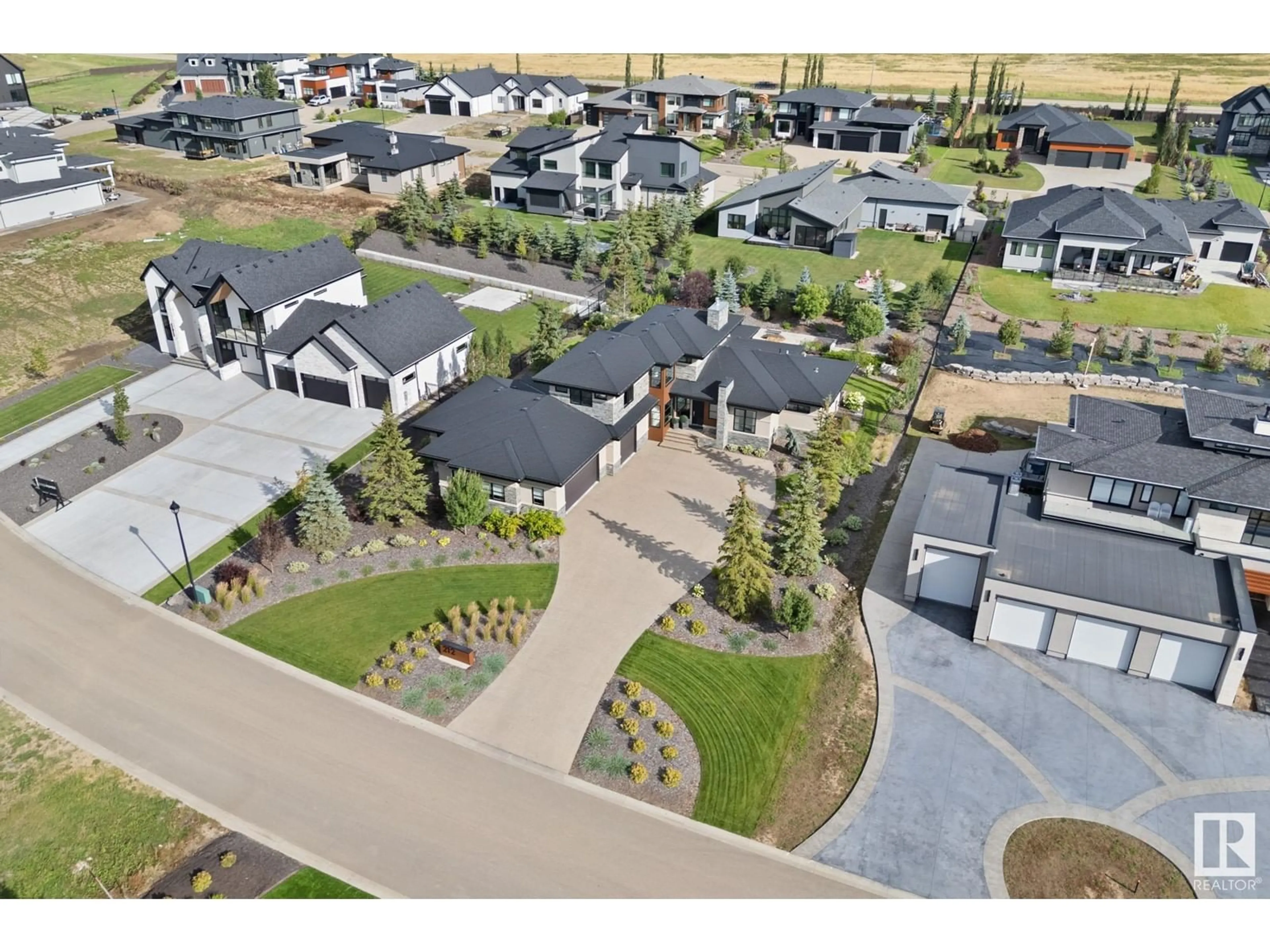 A pic from outside/outdoor area/front of a property/back of a property/a pic from drone, street for #212 25122 STURGEON RD, Rural Sturgeon County Alberta T8T1S6