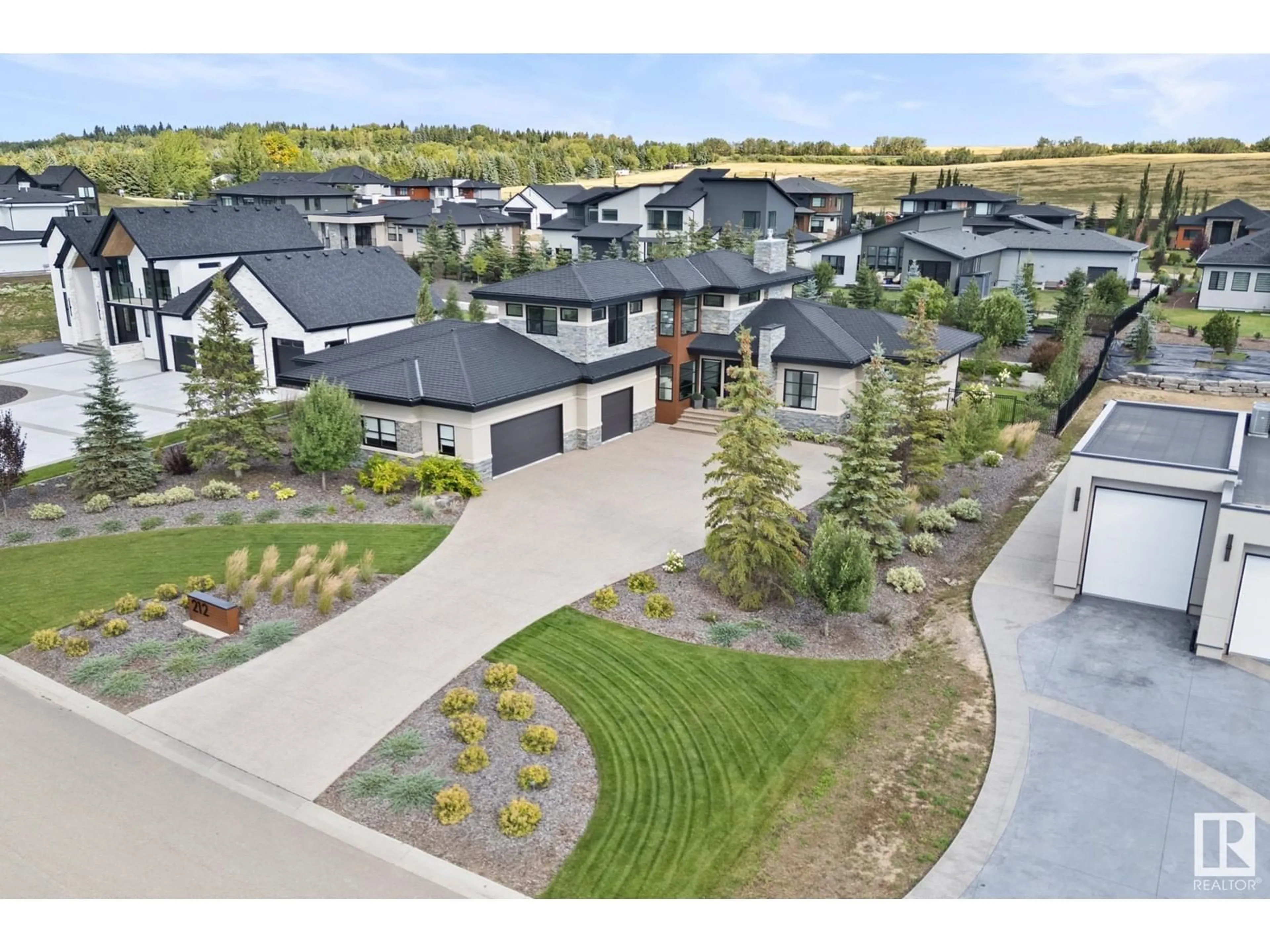 A pic from outside/outdoor area/front of a property/back of a property/a pic from drone, street for #212 25122 STURGEON RD, Rural Sturgeon County Alberta T8T1S6