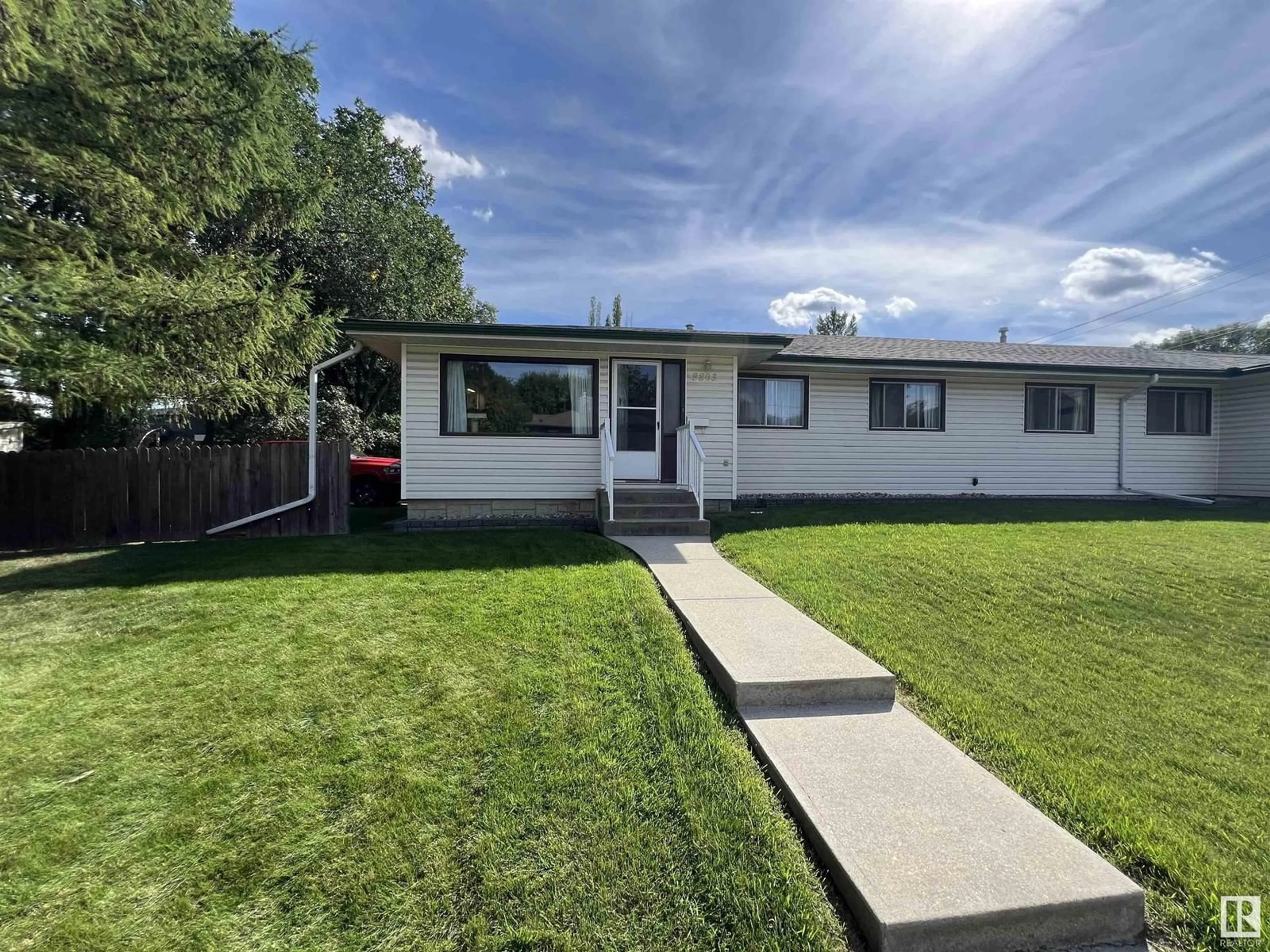 A pic from exterior of the house or condo, the fenced backyard for 8803 102 AV NW, Edmonton Alberta T5H0E1